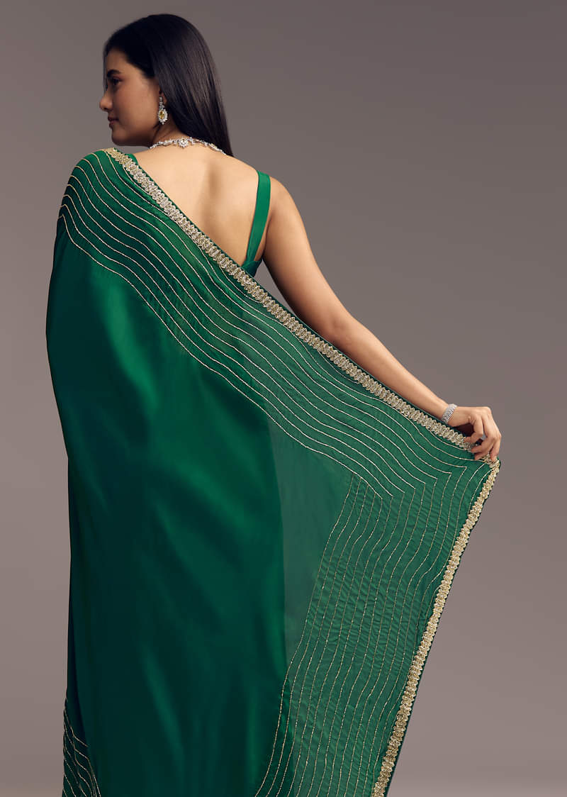 bottle-green-organza-saree-with-scalloped-cut-dana-detailing-sg317717-4_e95f819c-b554-47a4-bc4a-80d87a420630.jpg