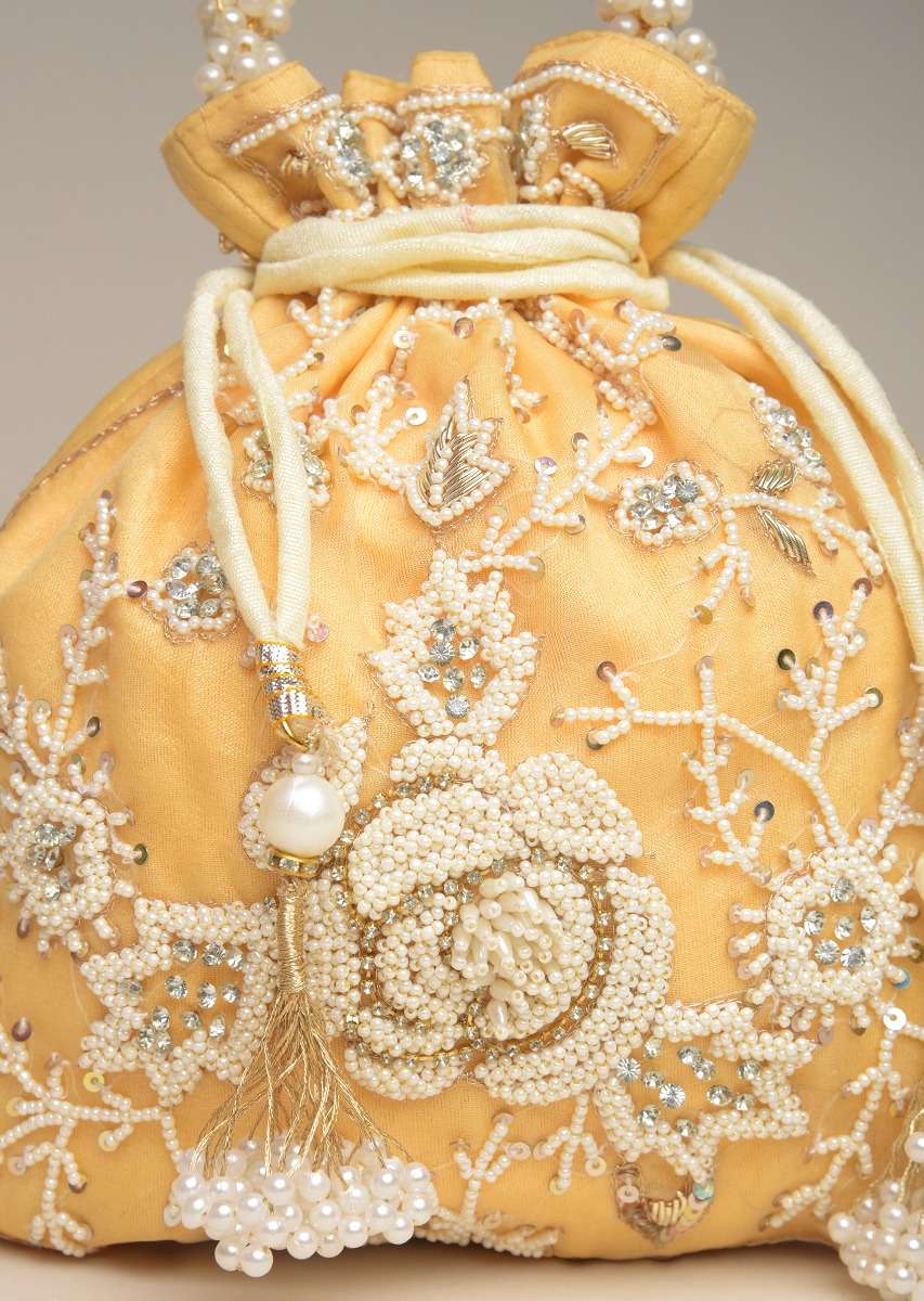 butter-yellow-potli-bag-in-raw-silk-with-moti-embroidery-in-rose-motif-and-floral-design-online-kalki-fashion-j017flowerpotliy-sg54838_4_c8e14d5a-189c-411d-92e3-4bac3a45bc21.jpg