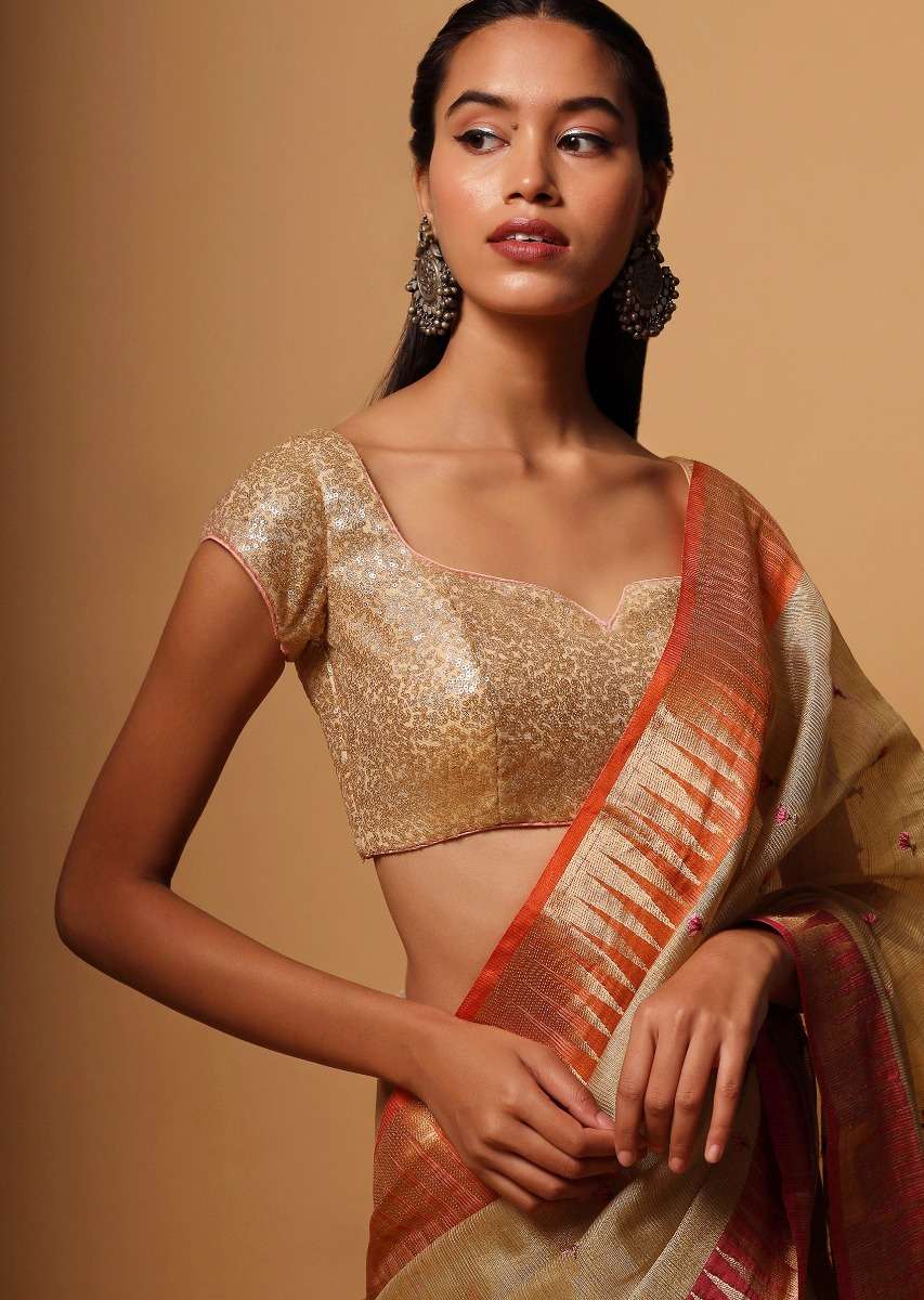 gold-blouse-in-net-with-contrasting-peach-piping-around-the-edges-and-sequins-work-all-over-online-kalki-fashion-m001bldy41y-sg57017_2_b22e1b5a-3a30-4df5-a9ba-67d21a1b1bad.jpg