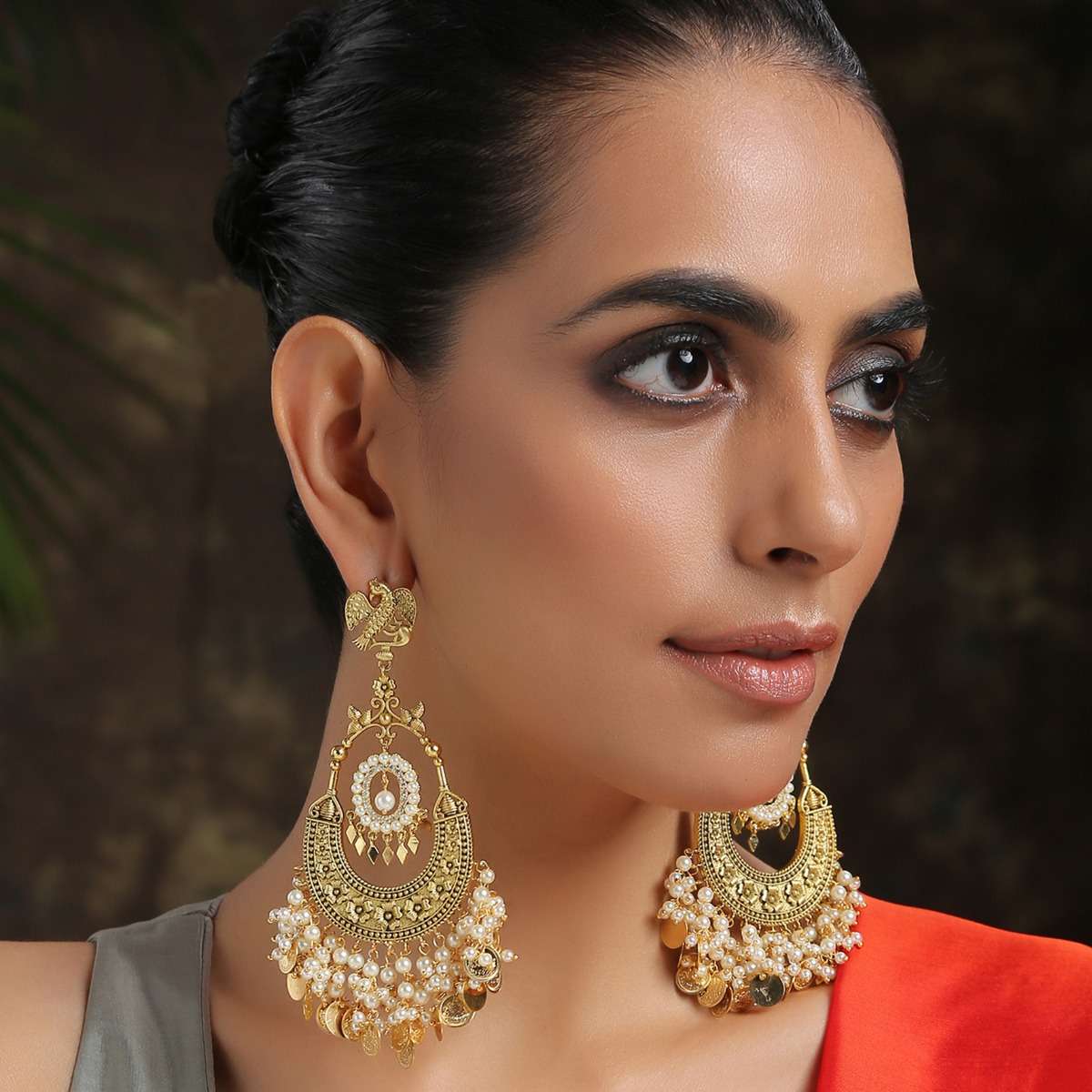 gold-chandbali-earrings-adorned-in-rich-shell-pearls-and-intricate-temple-detailing-by-paisley-pop-jk001ppsae70005y-sg65097_3__1_ee358182-0ef8-4626-b671-4627e3e5d358.jpg