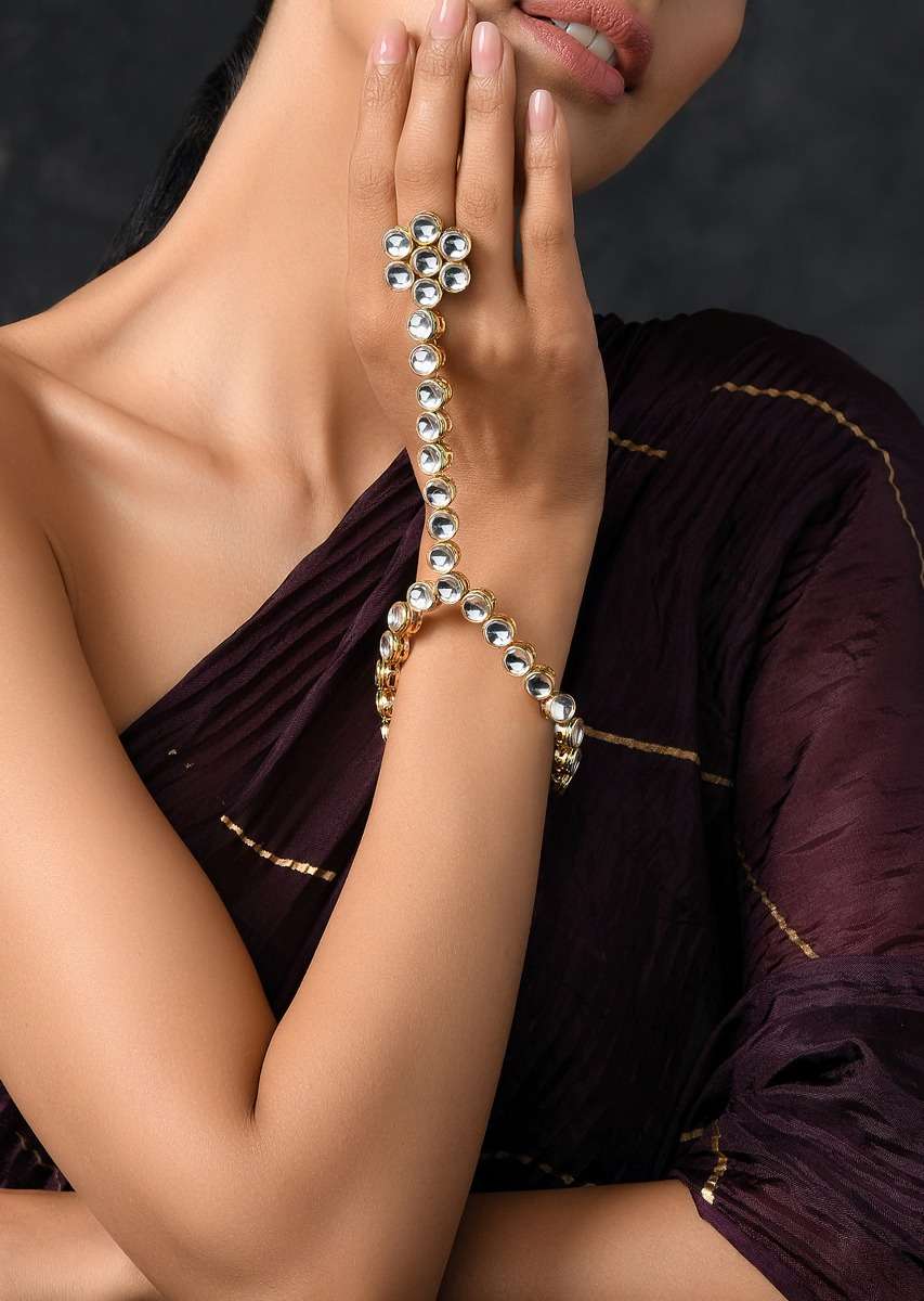 gold-plated-hand-harness-with-beautifully-handcrafted-floral-design-adorned-in-kundan-work-by-paisley-pop-jk001ppsab40010y-sg65312_4_10d54c8b-0106-47bc-9736-67c463b3c813.jpg