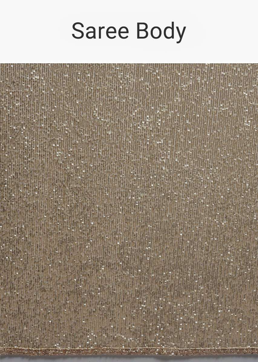 gold_beige_saree_in_sequins_fabric_with_fringes_on_the_pallu_and_unstitched_blouse_online_-_kalki_fashion_8_59c8fa6d-4211-4a40-8efb-03c614f8dcdb.jpg