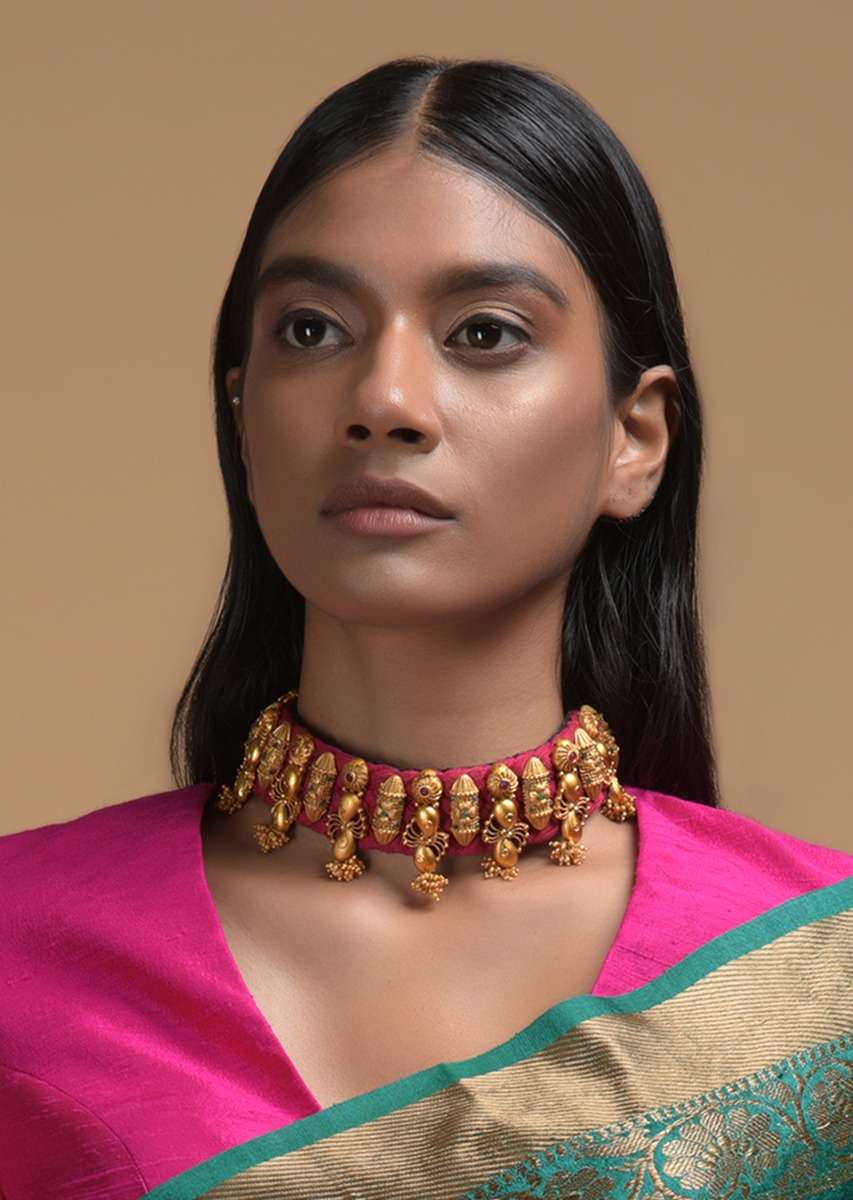 magenta-braided-choker-and-earrings-set-with-gold-plated-ethnic-charms-studded-with-green-and-magenta-stones-online-kalki-fashion-b139bbs11y-sg47807_1_8c3770bf-24ce-4e61-82b7-bd635d27_8188bb9e-b22f-4947-8c39-a196e25a20d1.jpg