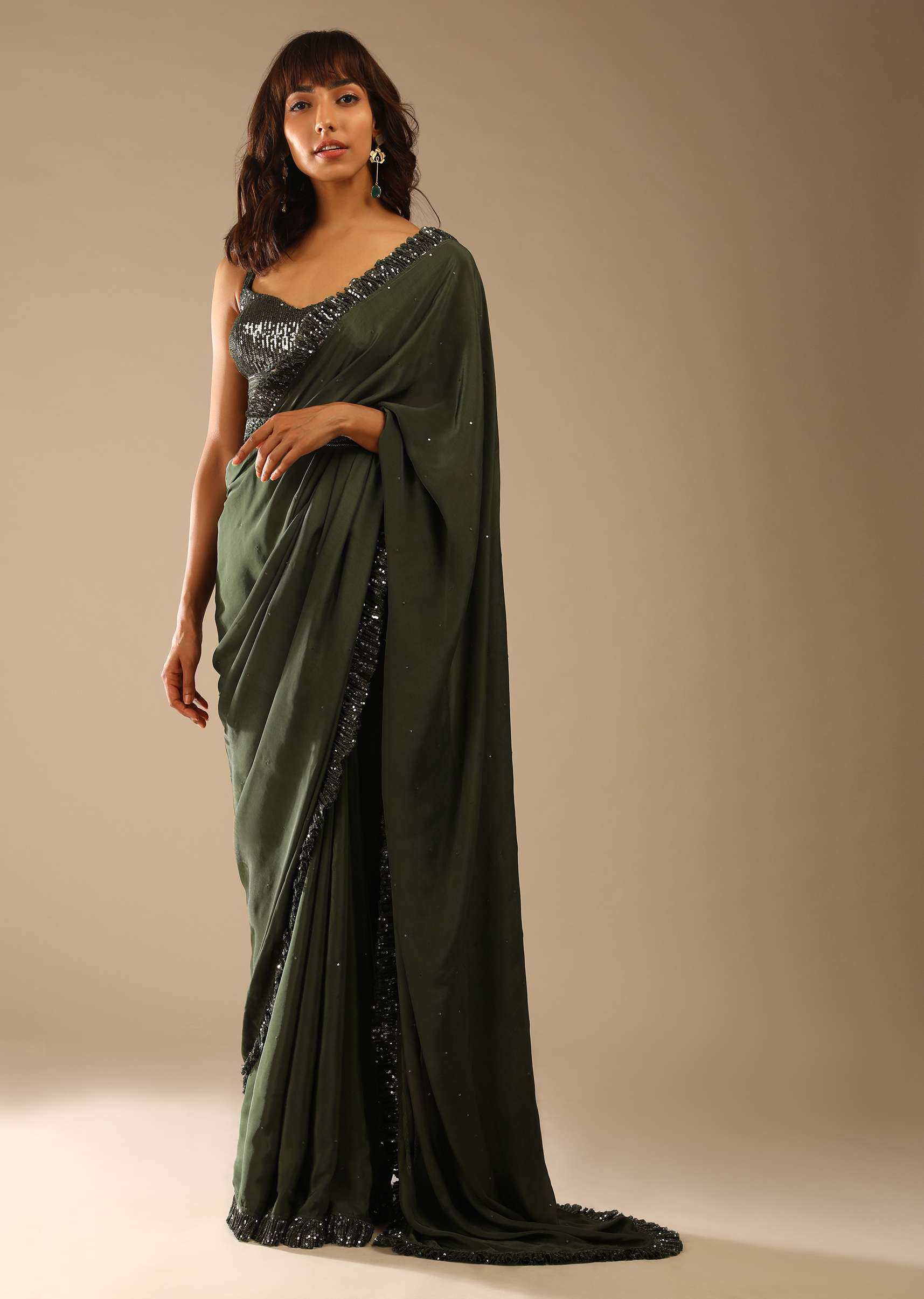 olive-green-saree-in-crepe-with-sequins-ruffle-on-the-border_-sequins-blouse-with-front-cut-out-and-embellished-belt-online-kalki-fashion-m001g2087y-sg61664_3_c9e64623-0c5d-4366-870b-80df4c0ad783.jpg
