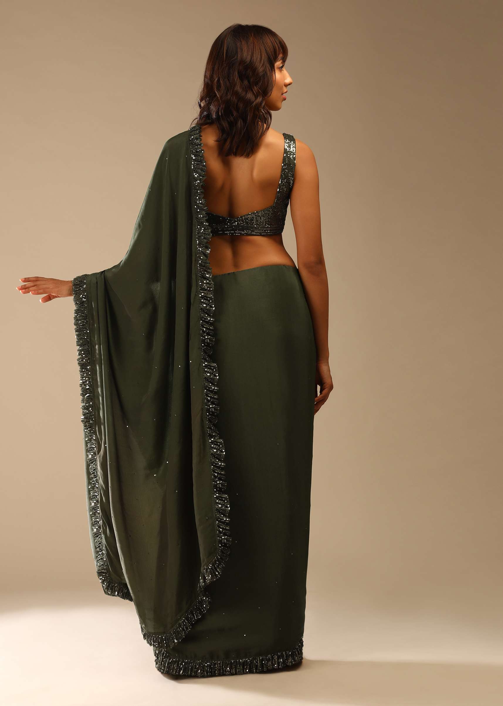 olive-green-saree-in-crepe-with-sequins-ruffle-on-the-border_-sequins-blouse-with-front-cut-out-and-embellished-belt-online-kalki-fashion-m001g2087y-sg61664_6_15da6283-0f87-4e2a-8d1d-2403425b7d76.jpg
