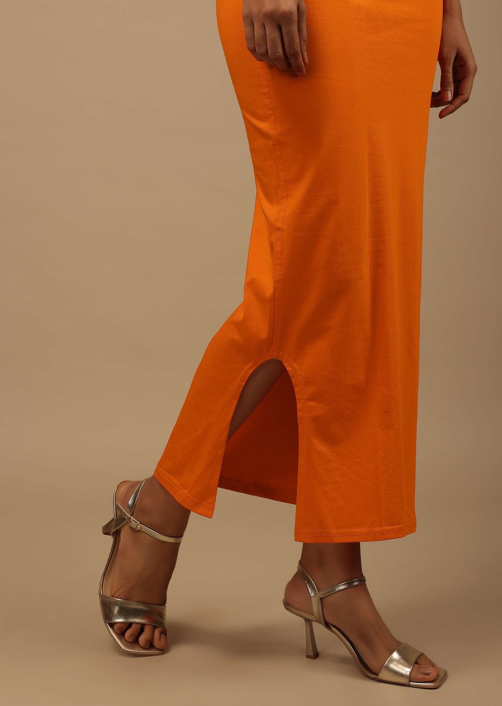 orange_shapewear_saree_petticoat_in_cotton_lycra_with_e_1_d51ba7a0-81bf-4912-9386-488651a16160.jpg