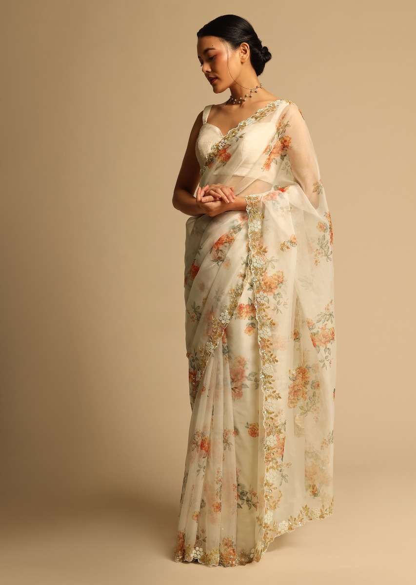pearl-white-saree-in-organza-with-floral-print-all-over-and-moti-embroidered-border-along-with-unstitched-blouse-online-kalki-fashion-k07303613656y-sg63147_2_d9df7476-efb2-4370-a63a-b72265ceb224.jpg