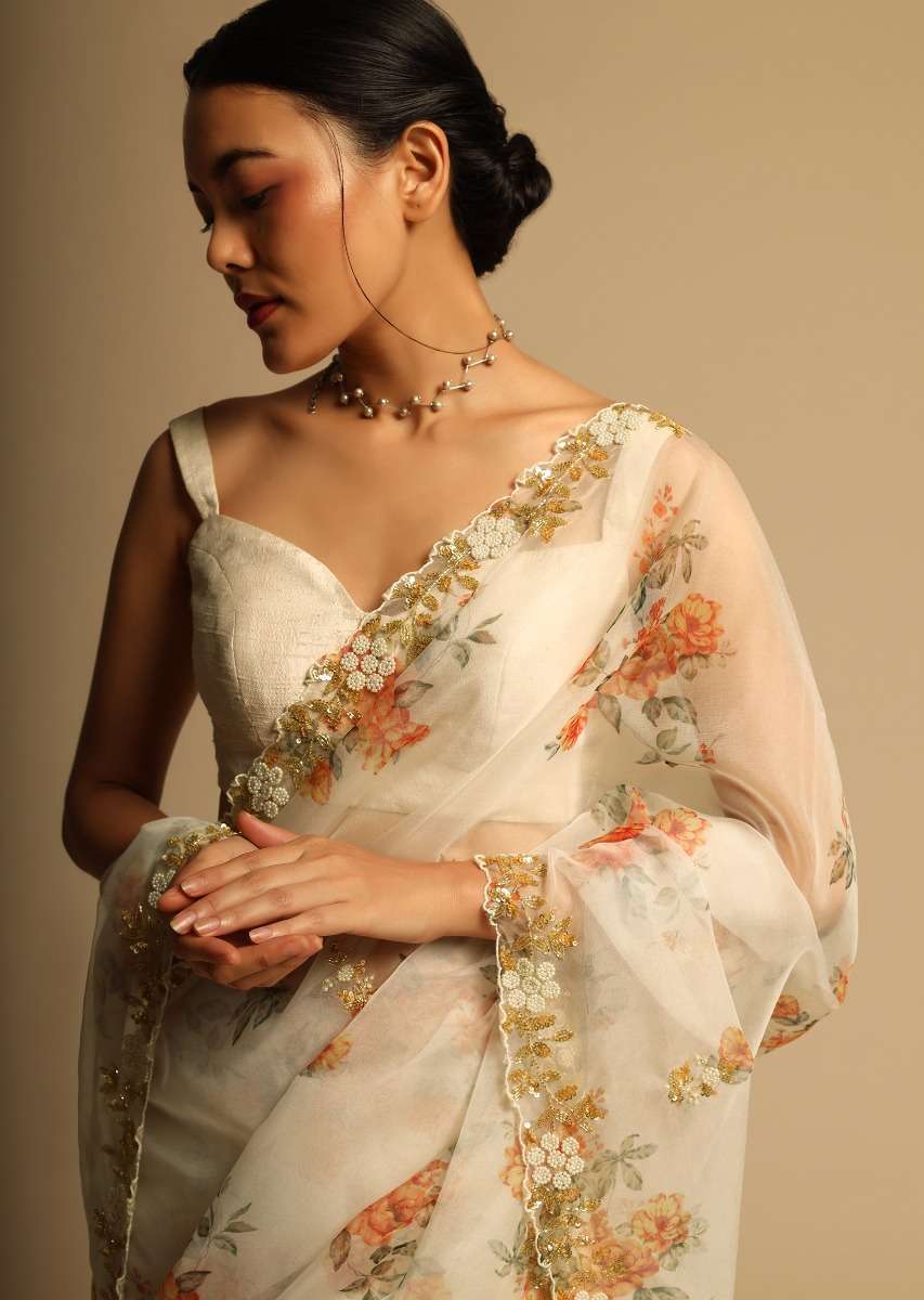 pearl-white-saree-in-organza-with-floral-print-all-over-and-moti-embroidered-border-along-with-unstitched-blouse-online-kalki-fashion-k07303613656y-sg63147_6_9a6f59f3-864f-4314-9cf4-d3d4e497f8db.jpg