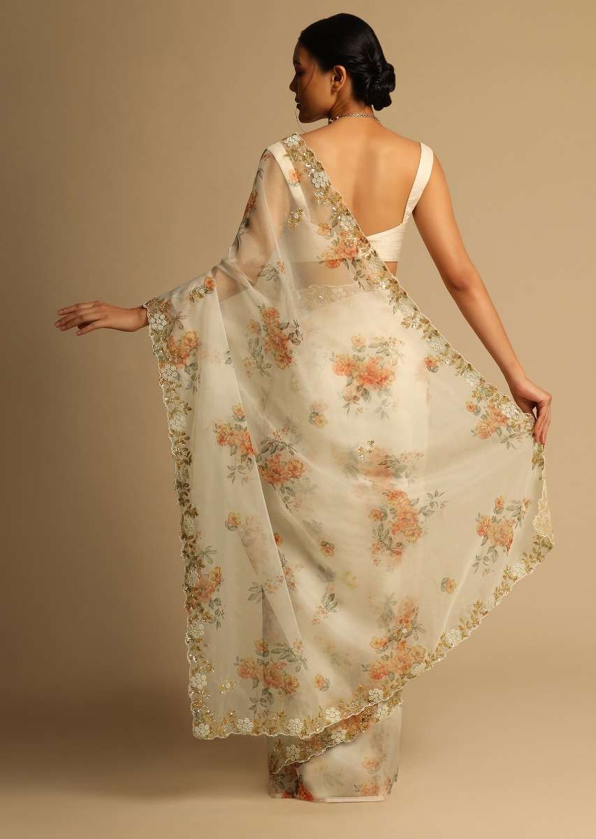 pearl-white-saree-in-organza-with-floral-print-all-over-and-moti-embroidered-border-along-with-unstitched-blouse-online-kalki-fashion-k07303613656y-sg63147_7_e048d24b-74af-4303-85fc-cd16c21be29a.jpg