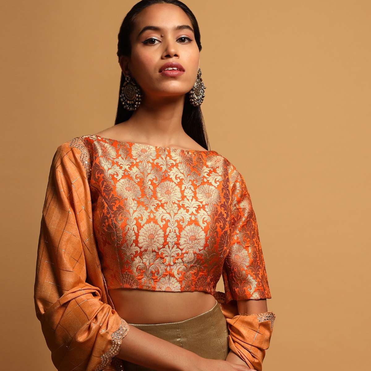 tangerine-orange-blouse-in-brocade-silk-with-woven-floral-jaal-and-34th-sleeves-online-kalki-fashion-m001459180y-sg33914_3_0b6723e2-2beb-4469-81ea-c75356288dae.jpg