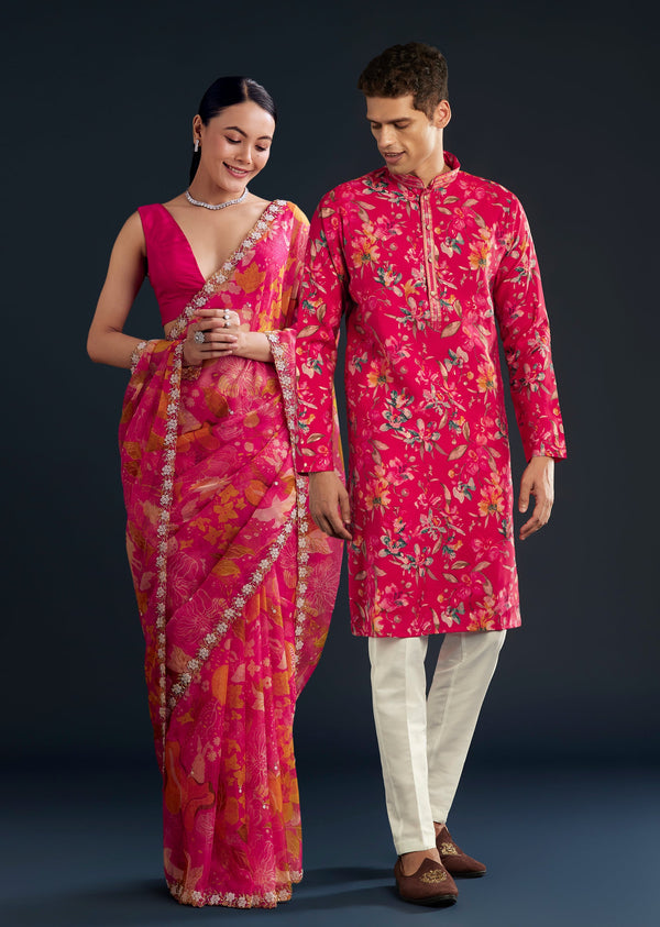 Romantic Festive Couple Set – Pink Organza Floral Saree With Embellished Border For Her And Pink Silk Kurta Set With Floral Motifs For Him