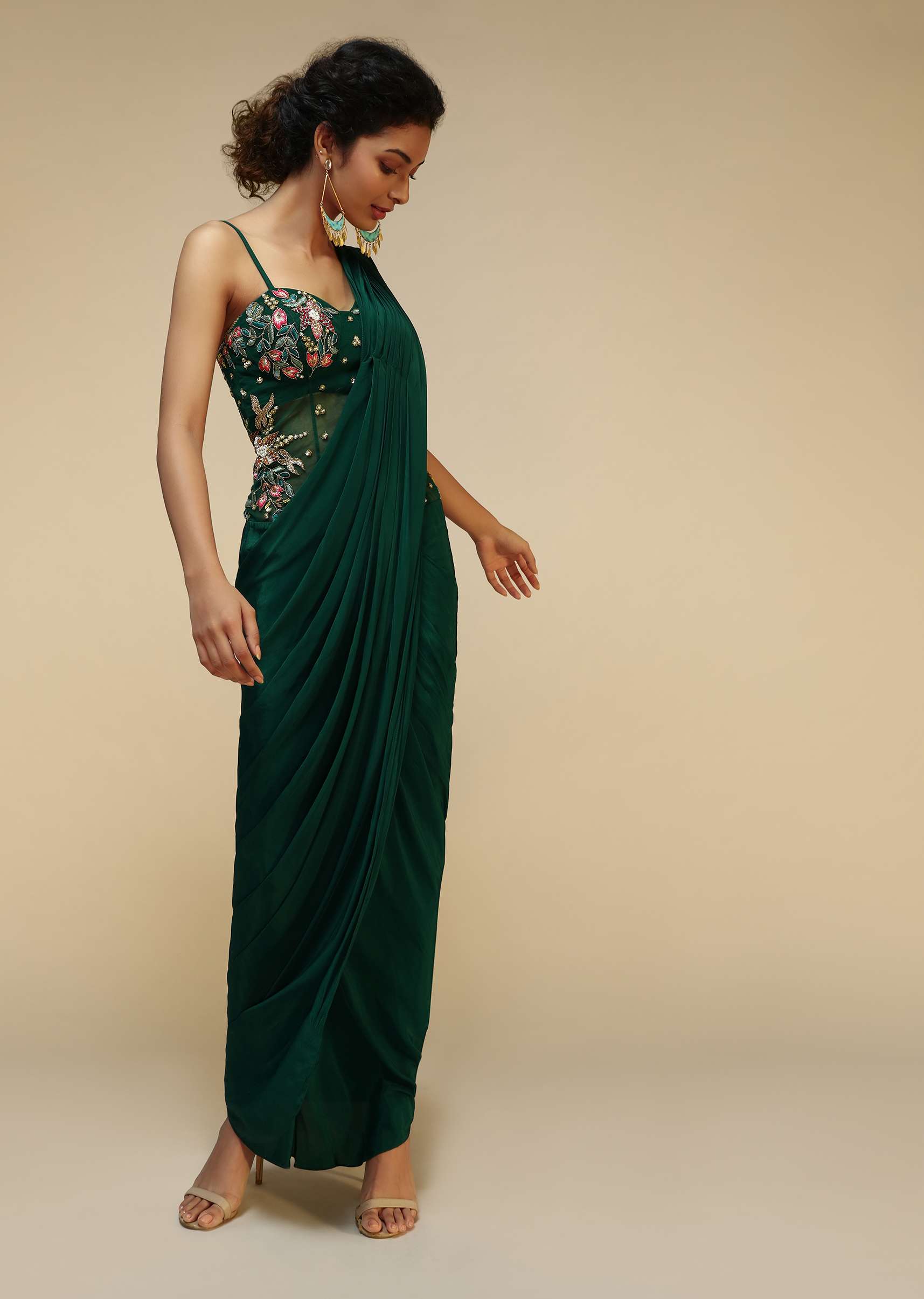 bottle-green-saree-gown-with-a-crepe-cowl-drape-and-sheer-embroidered-net-bodice-with-colorful-resham-flowers-online-kalki-fashion-m001at286y-sg53079_1_78c20184-6e0c-4fc1-bada-35c60f7.jpg