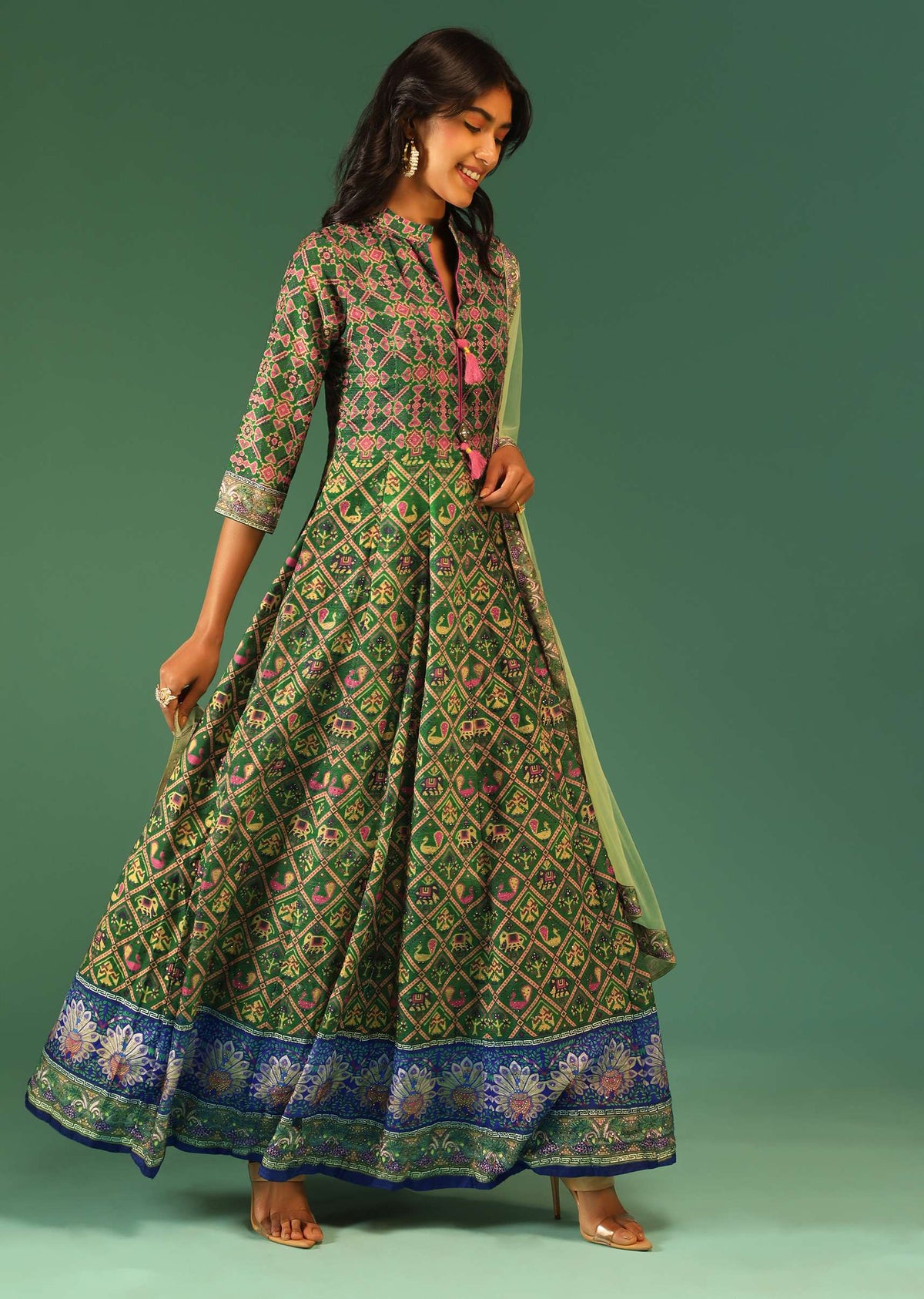 bottle_green_anarkali_suit_in_raw_silk_with_patola_print_and_kundan_detailing_along_with_a_yellow_net_dupatta_online_-_kalki_fashion_5_5_94ad68e9-a55e-475f-9403-8e4d568f4ff1.jpg