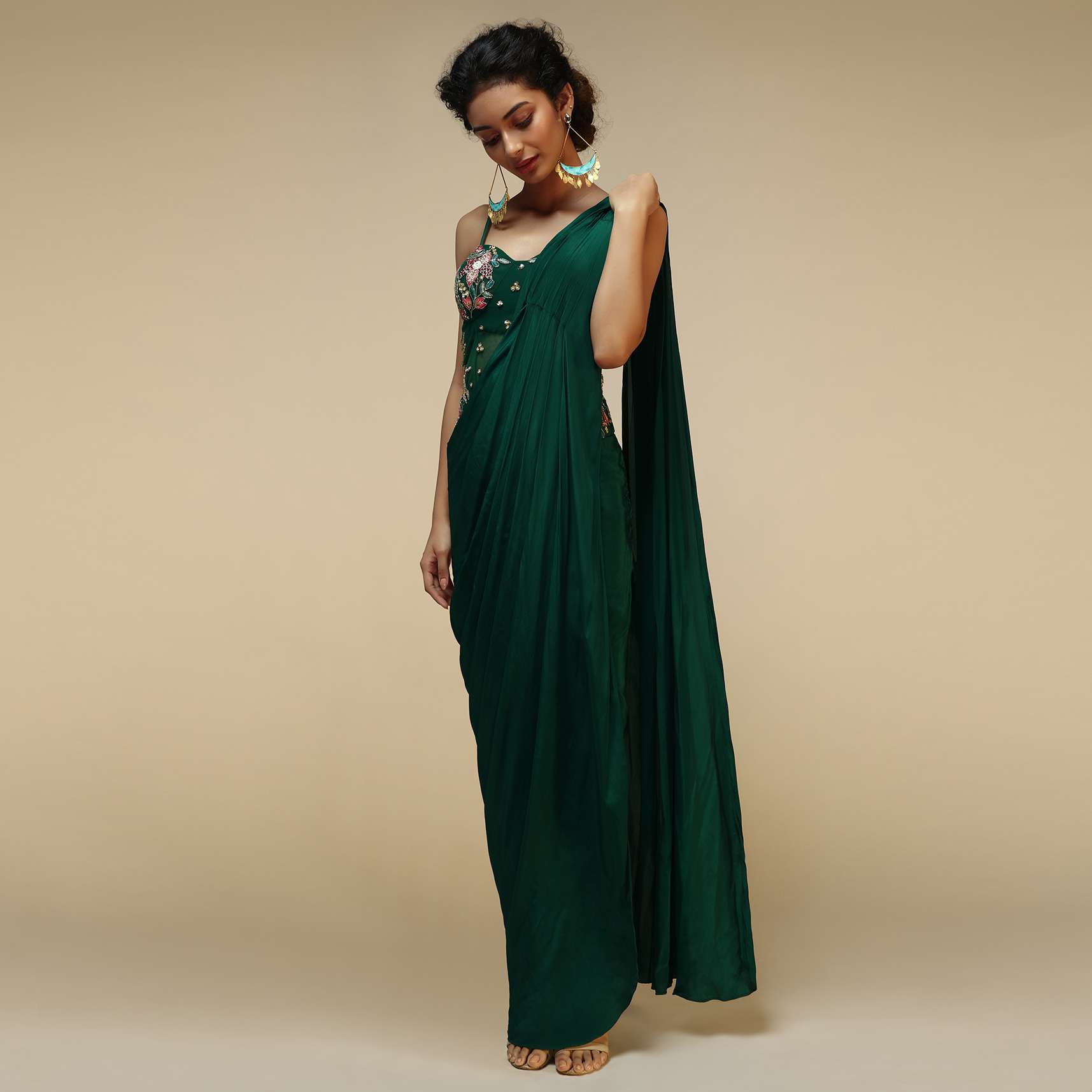 bottle_green_saree_gown_with_a_crepe_cowl_drape_and_sheer_embroidered_net_bodice_with_colorful_resham_flowers_online_-_kalki_fashion_1_1_ff6c7dc0-0a80-4033-85de-08b3696580b9.jpg
