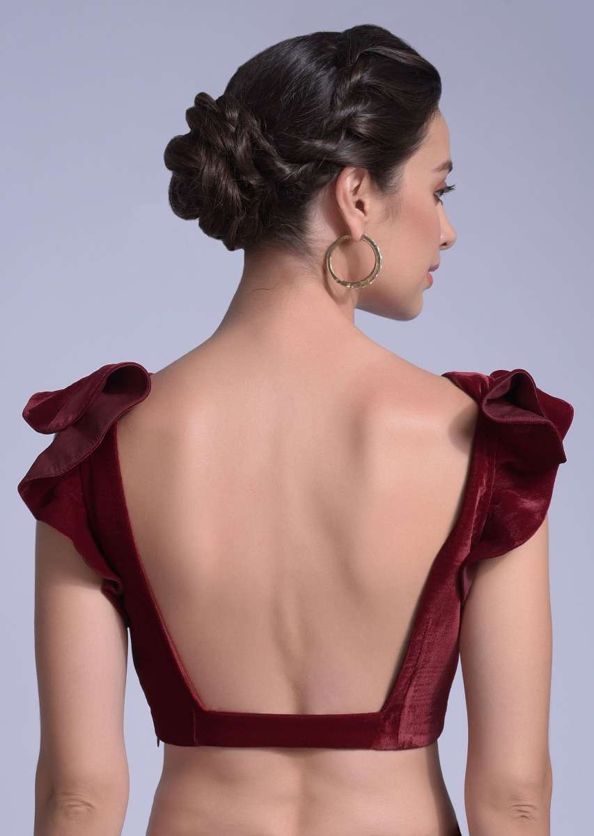 cherry-red-blouse-in-velvet-with-a-trapeze-neck-and-ruffle-sleeves-online-kalki-fashion-m001dd602y-sg21337_5_18883eb6-9344-439b-a31d-ebb06ac91f79.jpg