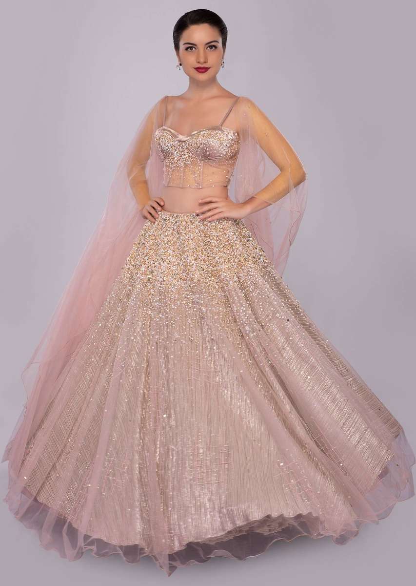 dusty-pink-lehenga-paired-with-multi-paneled-corset-blouse-with-attached-net-drape-only-on-kalki-460501_7__1_10_cc7e8a83-3c23-4d16-a0d2-b1f8ab0b6bb6.jpg