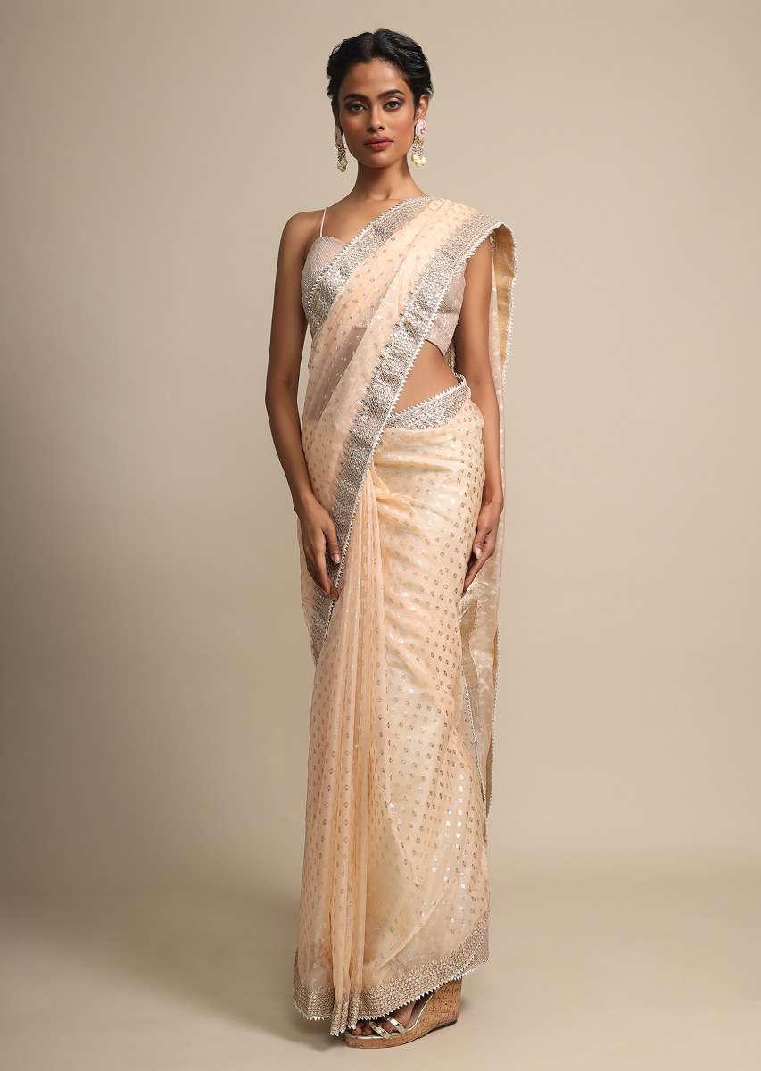foil-printed-peach-organza-saree-with-gotta-embroidered-border-online-kalki-fashion-j01933178y-sg26687_1_cad669e5-e443-4e1c-a82f-c64ace8be5bd.jpg