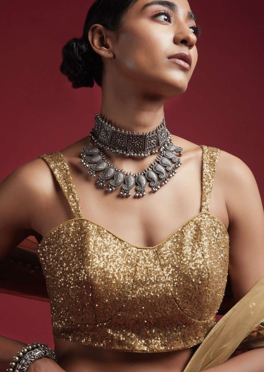 gold-blouse-in-sequins-fabric-with-tapering-straps-on-the-shoulders-and-corset-neckline-online_-kalki-fashion-m001bldy44y-sg57020_4__1_a3b8c209-27ac-4f32-bdbe-a6d3d71deaec.jpg