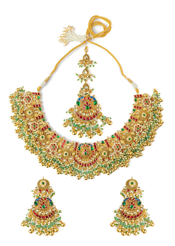 Gold Plated Pink Synthetic Stone Necklace Set With Earrings And Maangtikka