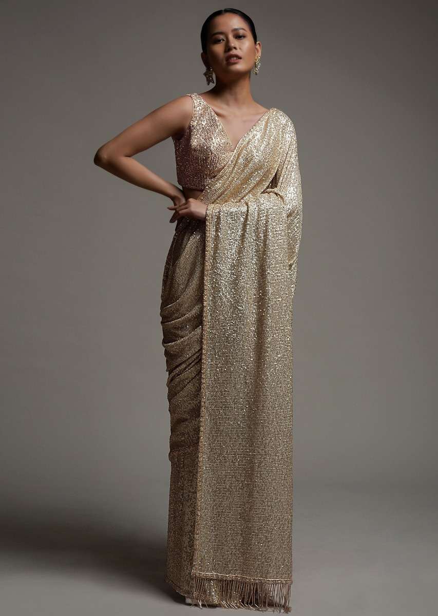 gold_beige_saree_in_sequins_fabric_with_fringes_on_the_pallu_and_unstitched_blouse_online_-_kalki_fashion_2_68e645ca-c504-460a-8d36-4eb80eb8a1aa.jpg
