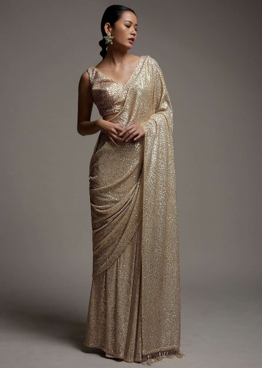 gold_beige_saree_in_sequins_fabric_with_fringes_on_the_pallu_and_unstitched_blouse_online_-_kalki_fashion_3_c9cdb871-a837-48f2-bef1-3d0d1c972a8a.jpg