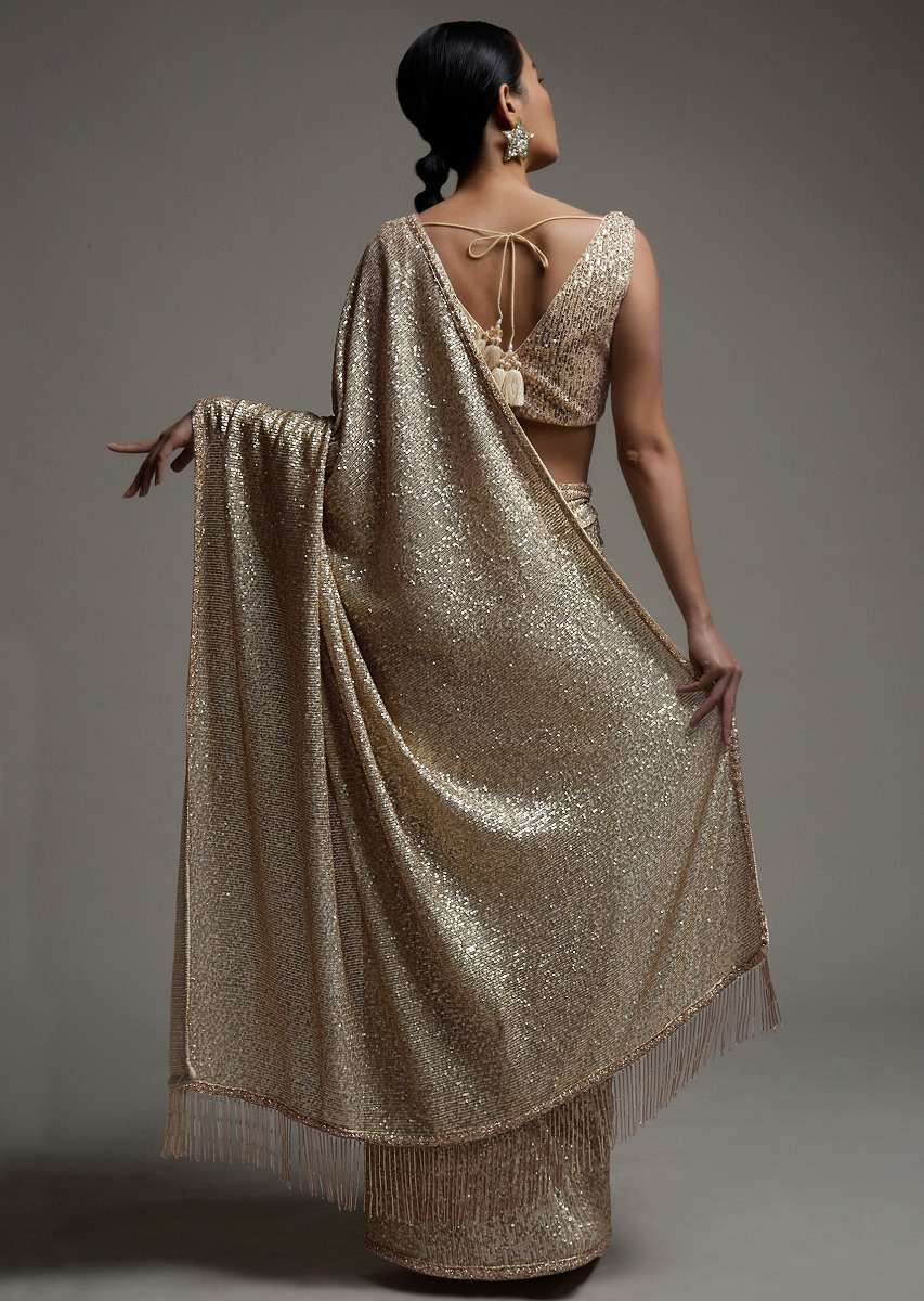 gold_beige_saree_in_sequins_fabric_with_fringes_on_the_pallu_and_unstitched_blouse_online_-_kalki_fashion_6_0ce5f2a8-b928-4e78-817d-6ad76053b1ef.jpg