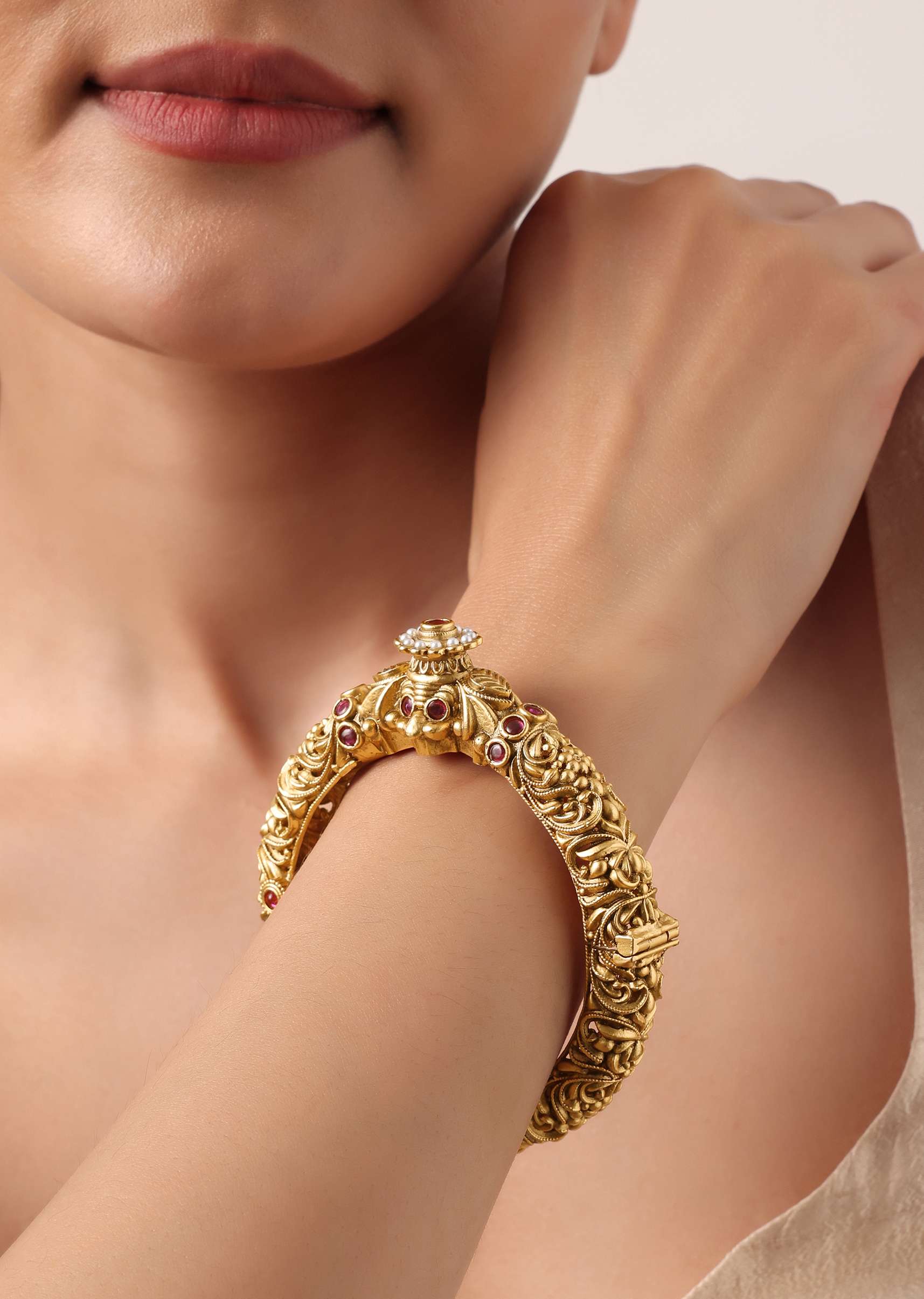 gold_plated_temple_bangle_with_carved_detail_and_red_stones-sg211080_4_4d870abd-5947-463a-973d-ad5f546e1024.jpg
