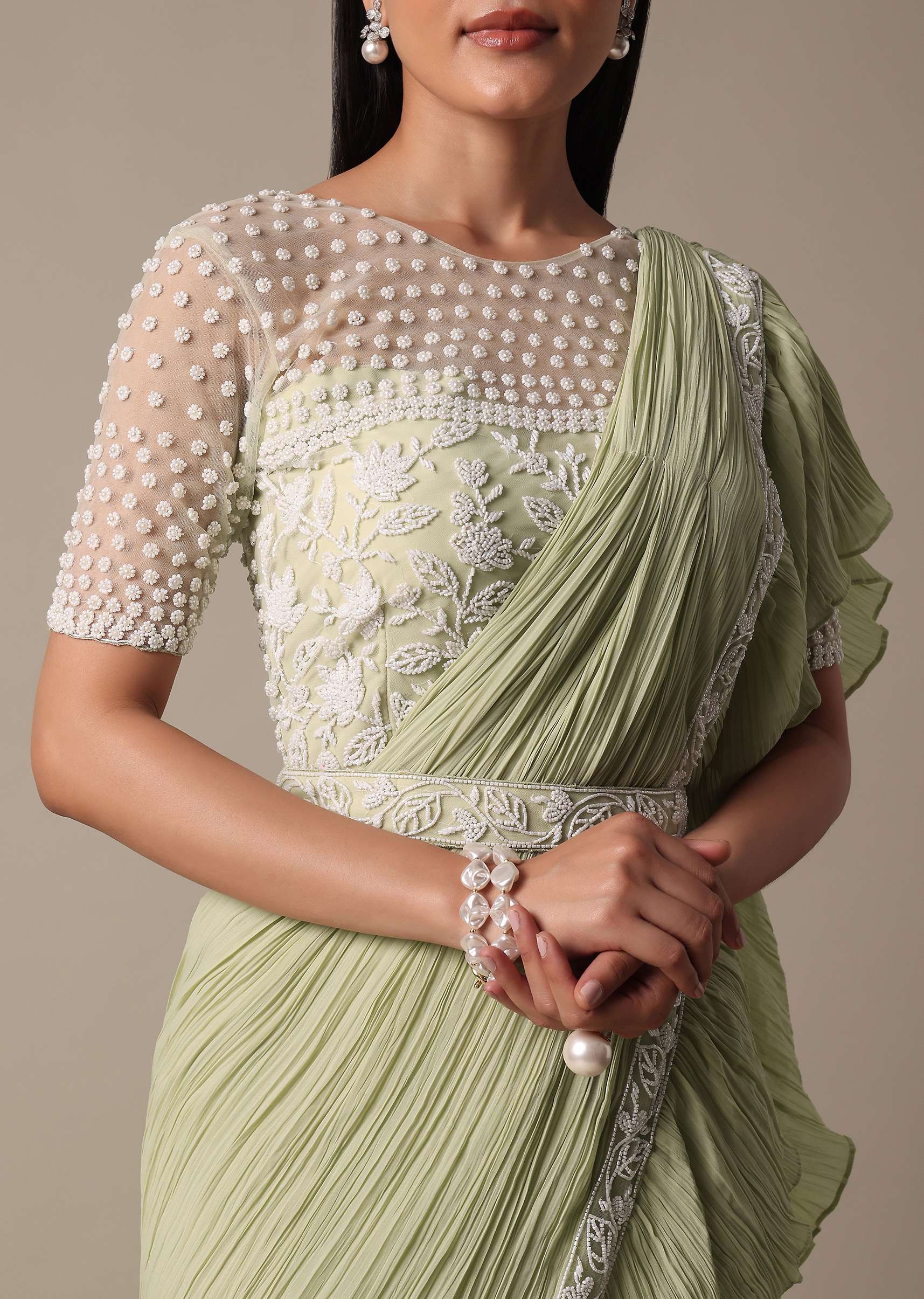 graceful_green_pleated_saree_with_ready-made_blouse-sg214122_4_614886a0-4471-40f5-b8c1-3b0901fe93fa.jpg