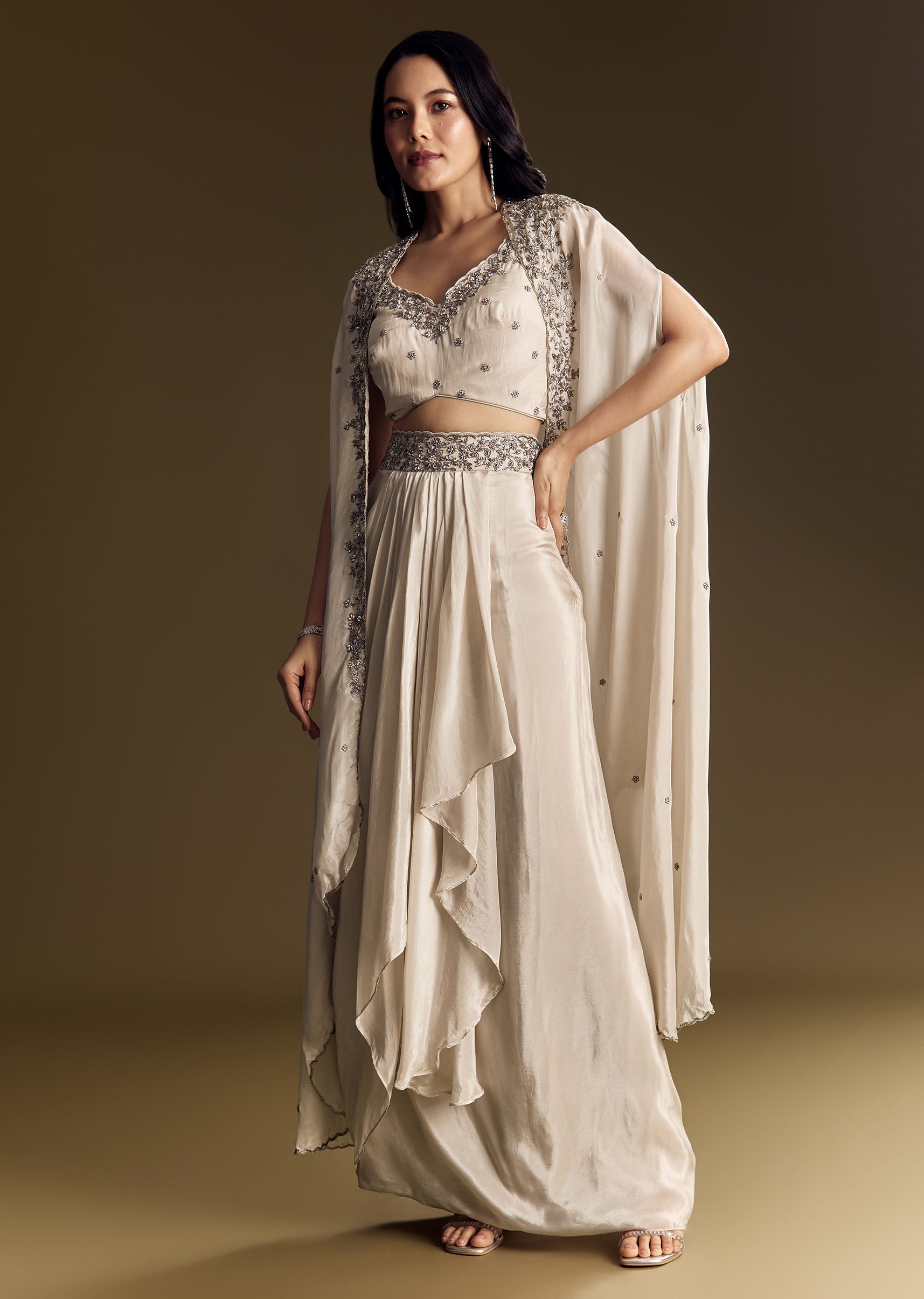 ivory-crop-top-skirt-set-with-cape-and-silver-zardozi-work-sg319679-1_7cbe25f5-ea61-4e62-8c01-ad6d5ac178a2.jpg
