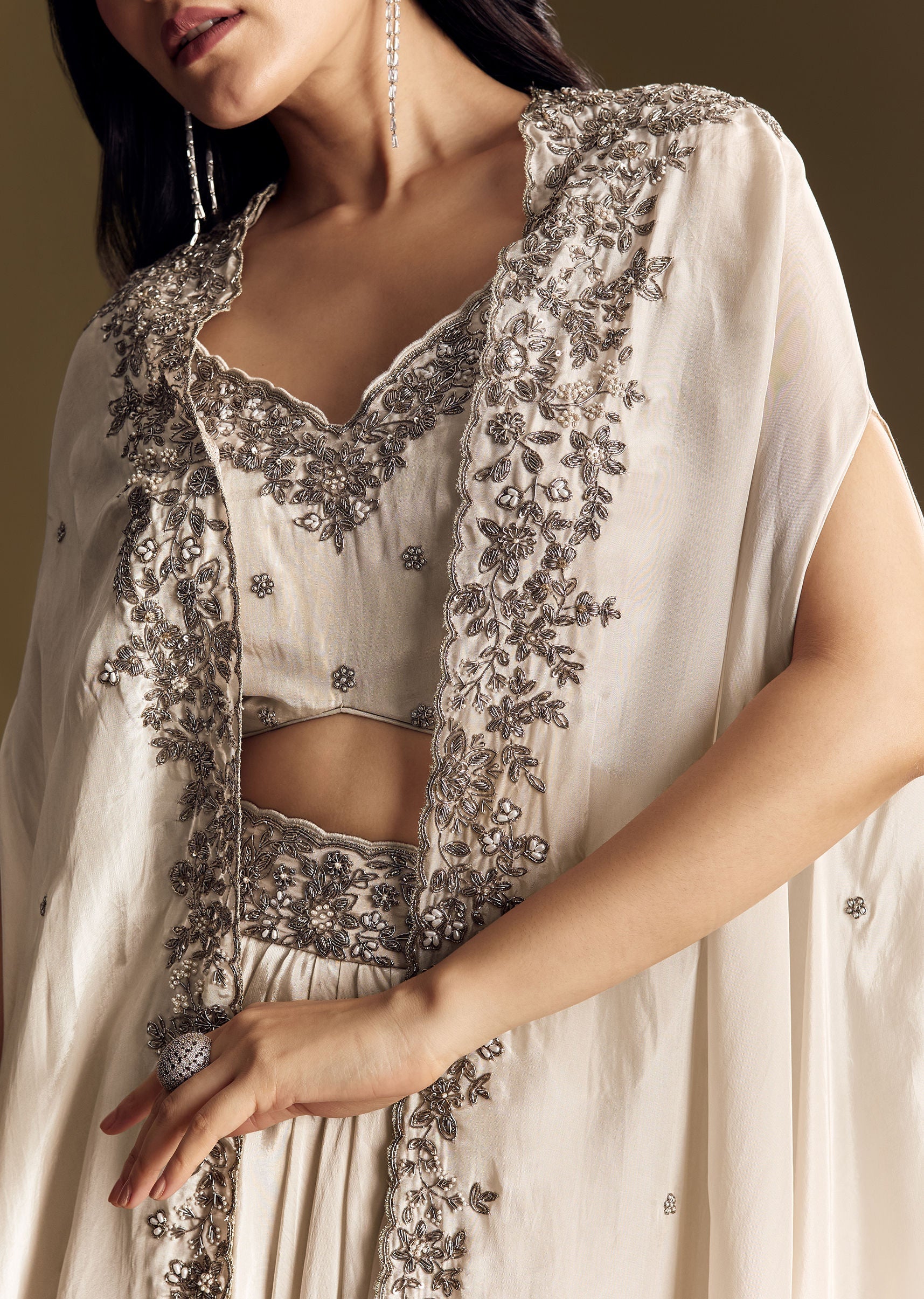 ivory-crop-top-skirt-set-with-cape-and-silver-zardozi-work-sg319679-2_7fa51b55-0291-47c8-9daa-3b9231076101.jpg