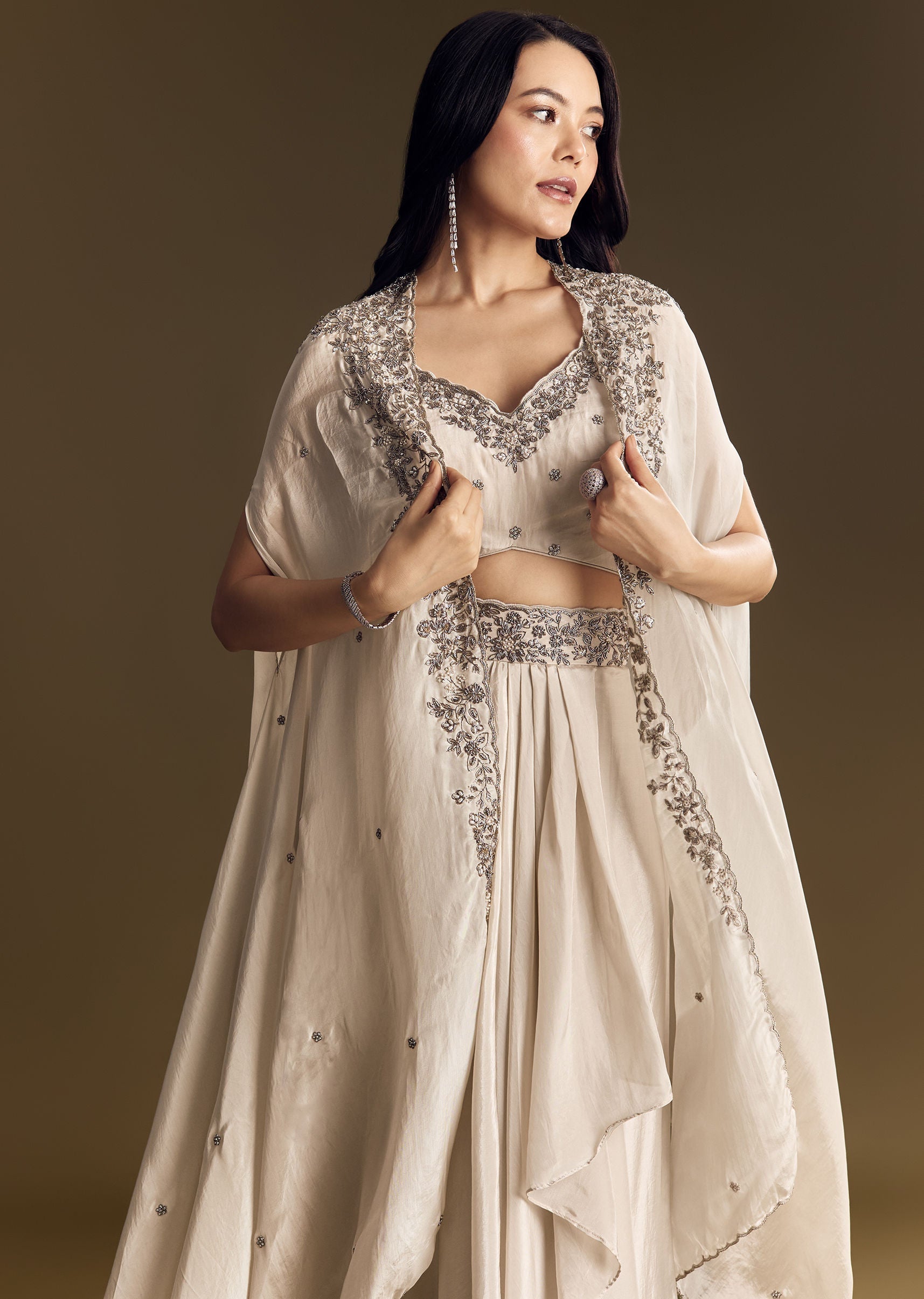 ivory-crop-top-skirt-set-with-cape-and-silver-zardozi-work-sg319679-4_8420199f-1c66-49ac-b92a-0b2010e82433.jpg