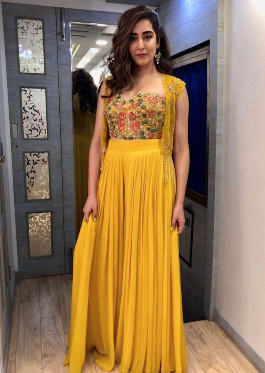 jonita-gandhi-in-kalki-dustan-sun-mustard-palazzo-in-georgette-with-strapless-corset-and-embroidered-net-jacket-with-tassels-485800_1_6ce42a51-4ba3-4089-92e1-9df2e0d2b233.jpg