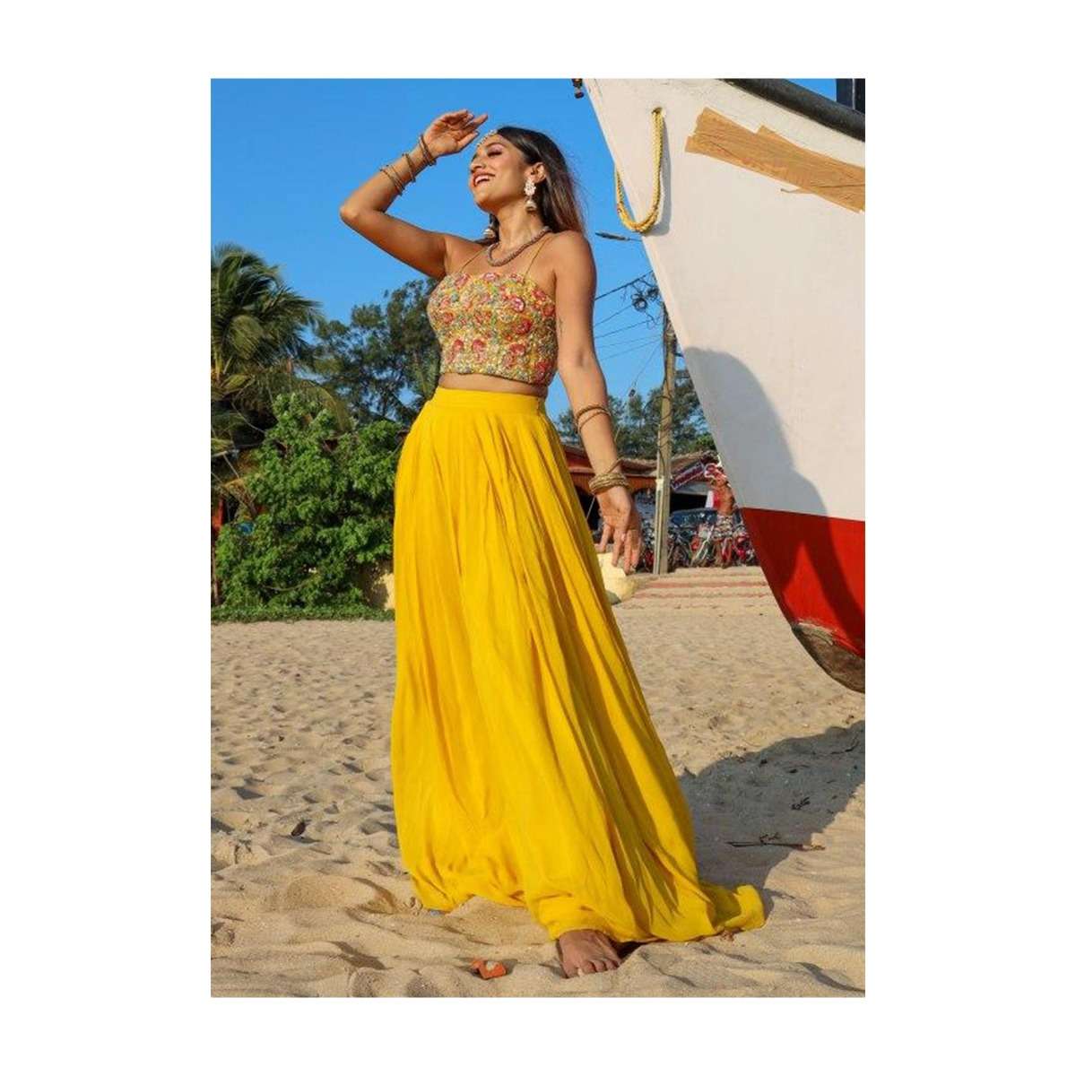 larissa_in_kalki_dustan_sun_mustard_palazzo_in_georgette_with_strapless_corset_and_embroidered_net_jacket_with_tassels_2.jpg