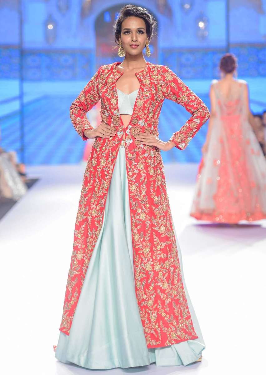 Mint green skirt and strap less corset blouse paired with fuchsia pink jacket with trial