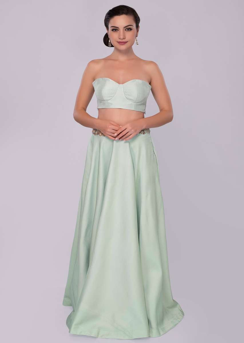 Mint green skirt and strap less corset blouse paired with fuchsia pink jacket with trial