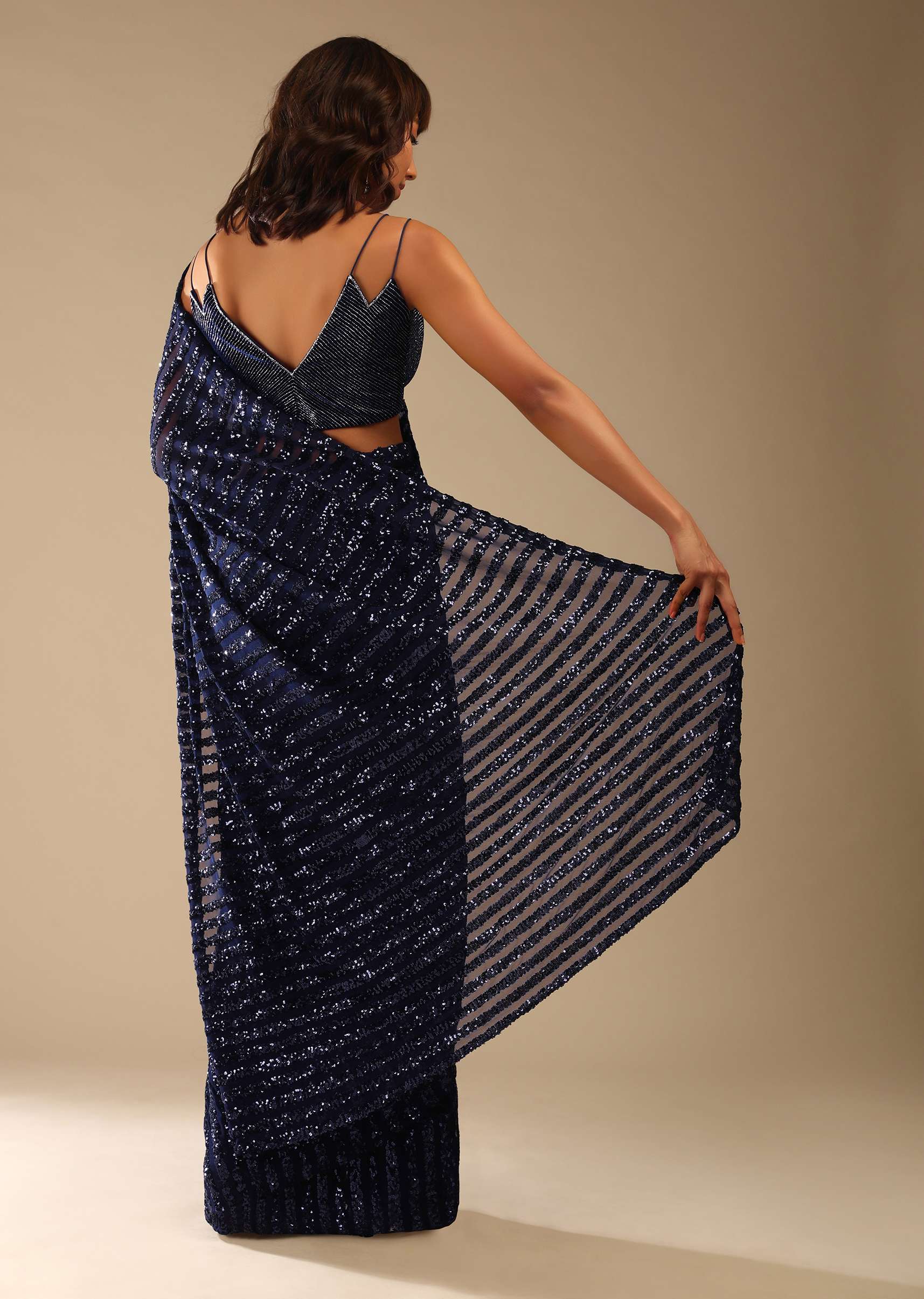 navy_blue_saree_in_striped_sequins_fabric_and_a_cut_dana_embellished_velvet_blouse_with_double_spaghetti_straps_online_-_kalki_fashion_89_2_6b7f5293-9c45-4628-84c7-60e67608f15b.jpg