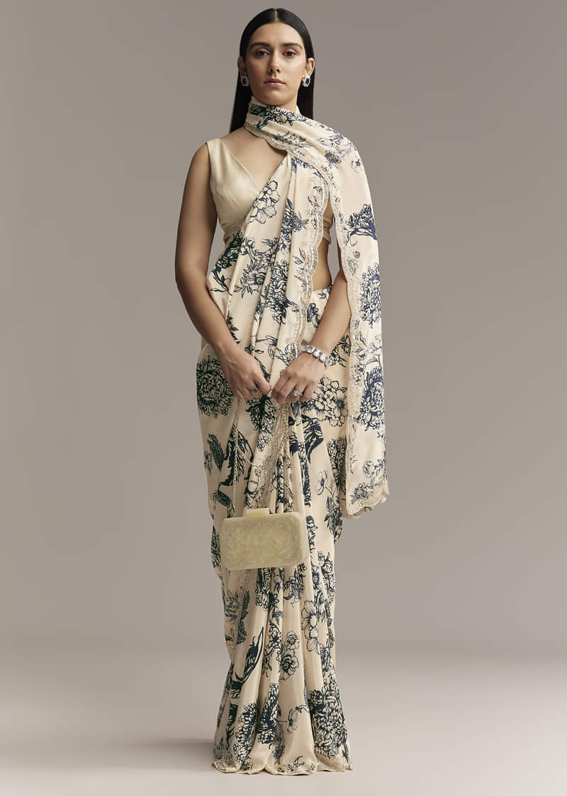 off-white-crepe-saree-with-black-floral-print-and-embroidered-border-sg328006-1.jpg