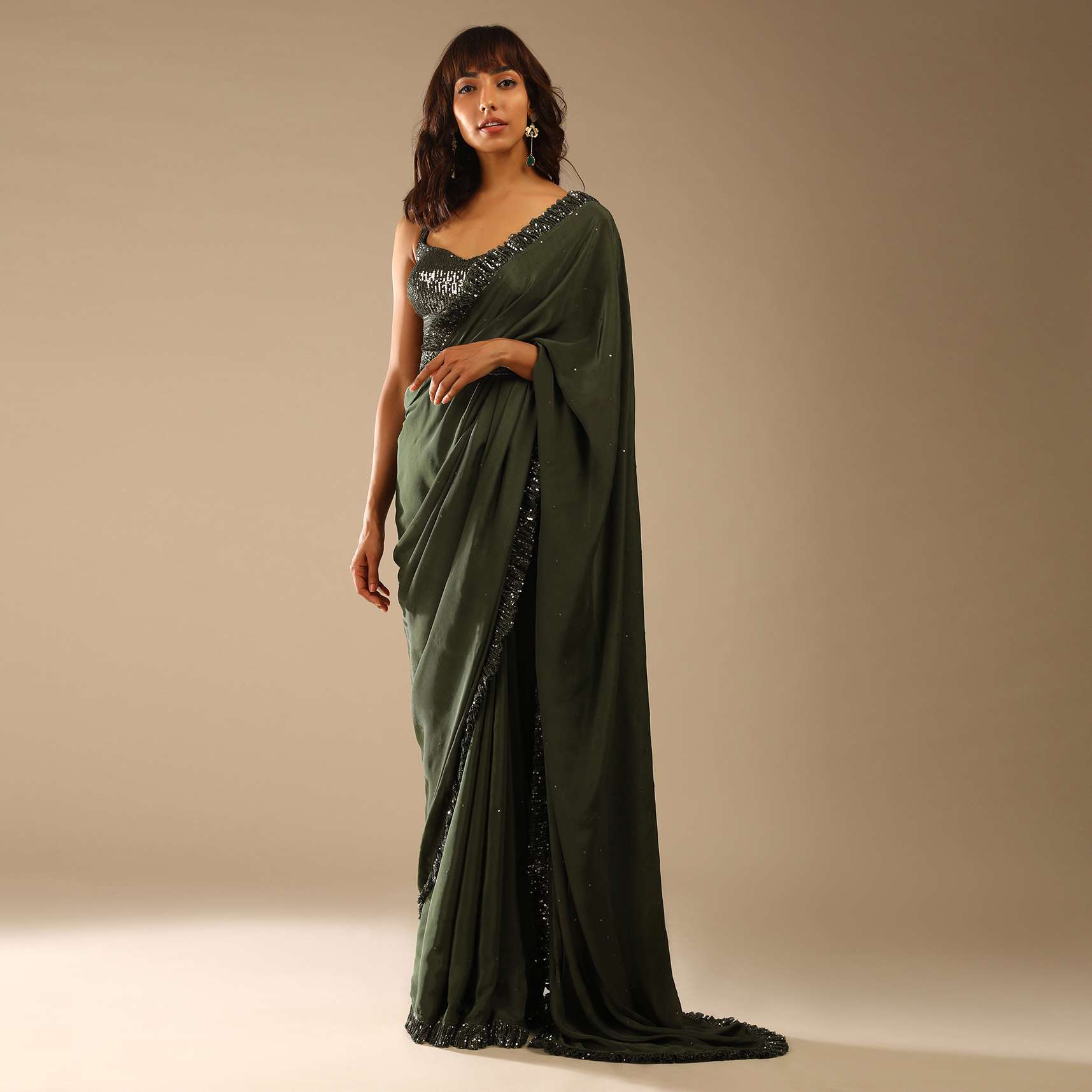 olive-green-saree-in-crepe-with-sequins-ruffle-on-the-border_-sequins-blouse-with-front-cut-out-and-embellished-belt-online-kalki-fashion-m001g2087y-sg61664_4_cf03e3e8-c162-4340-96ba-e8930c6737f2.jpg