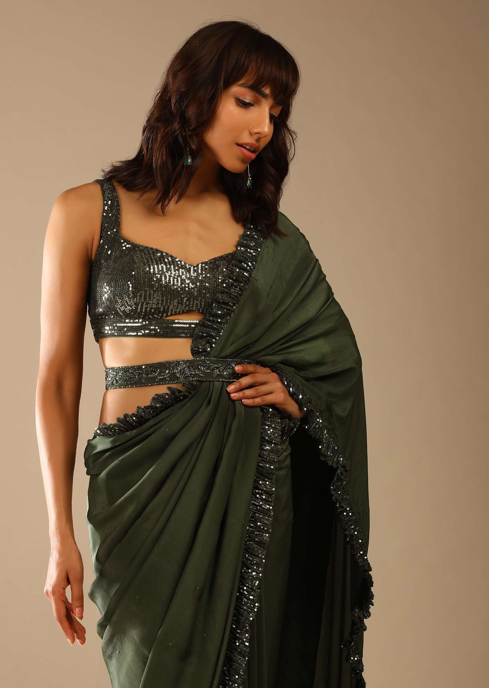 olive-green-saree-in-crepe-with-sequins-ruffle-on-the-border_-sequins-blouse-with-front-cut-out-and-embellished-belt-online-kalki-fashion-m001g2087y-sg61664_5_d67e593f-5b66-436a-8d2a-ad8e25be2c21.jpg