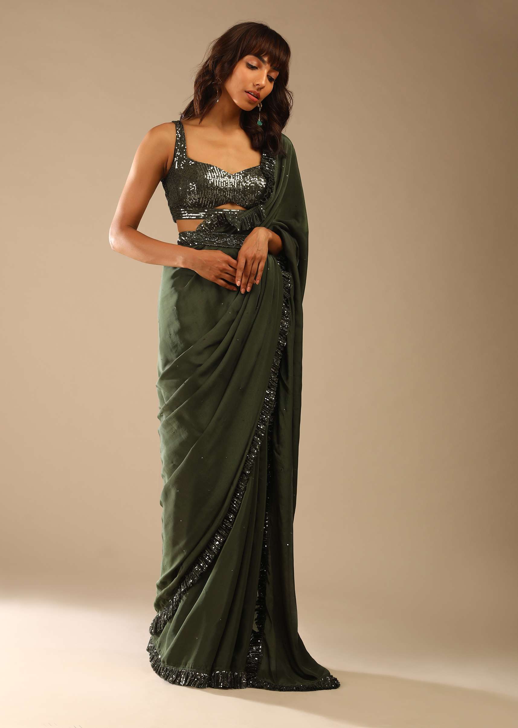 olive-green-saree-in-crepe-with-sequins-ruffle-on-the-border_-sequins-blouse-with-front-cut-out-and-embellished-belt-online-kalki-fashion-m001g2087y-sg61664_9_53712bcd-8acd-4793-a69c-b3b8f2f7d20f.jpg