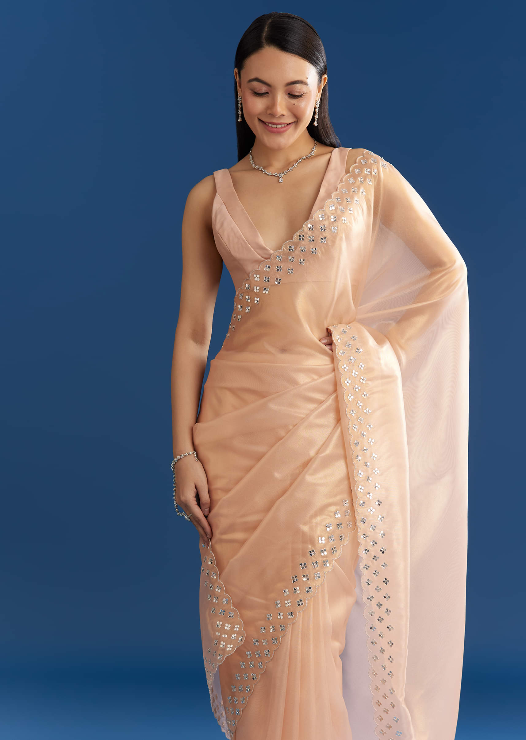 peach-organza-tissue-saree-with-cutdana-embellished-border-sg284843-2_7e4f558c-b78c-4ab0-a75f-6194b847b85b.jpg
