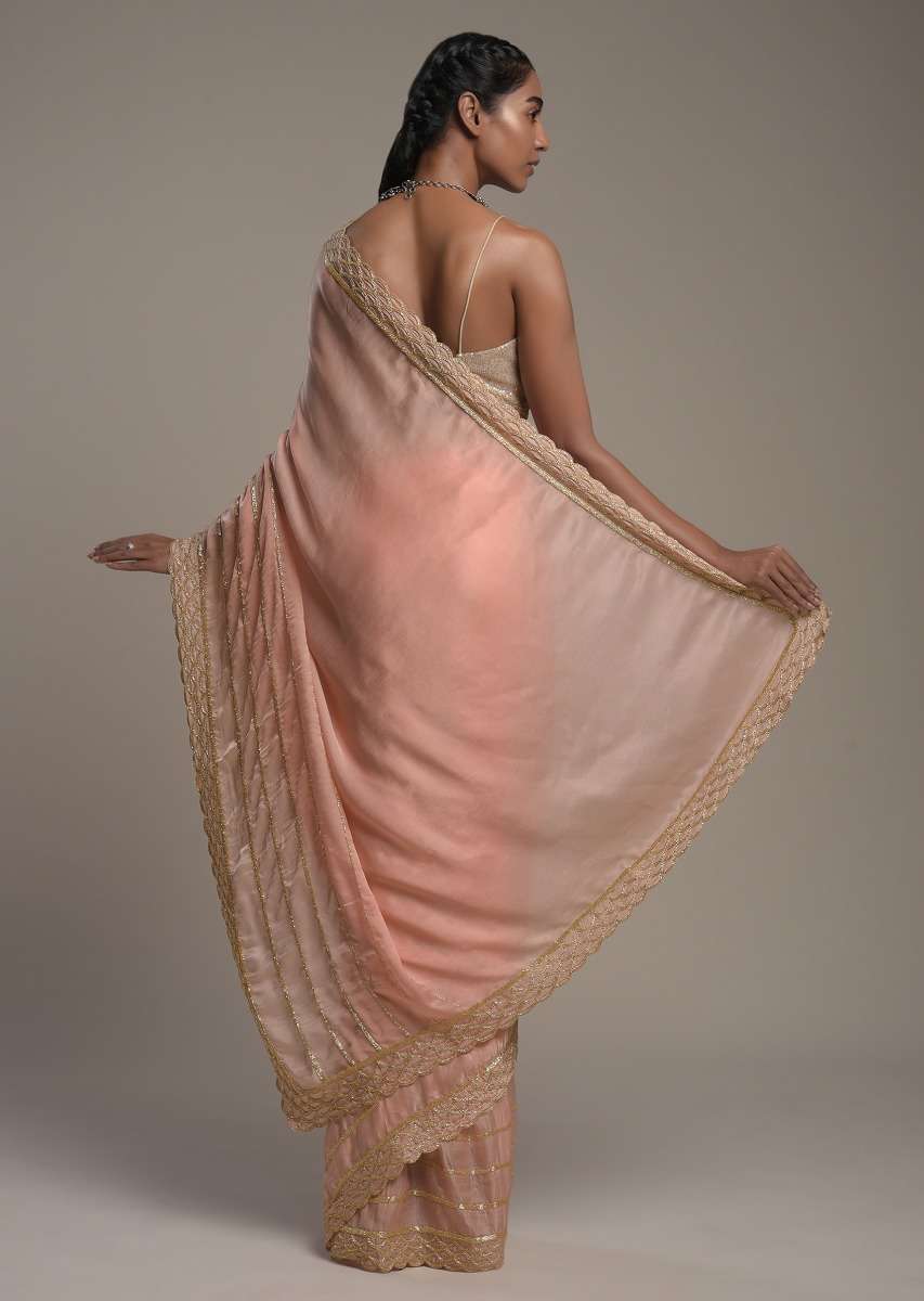 peach-saree-in-satin-with-cut-dana-and-zardosi-embroidered-stripes-and-unstitched-blouse-online-kalki-fashion-k002srhs1090y-sg53445_2_3d2d07a6-5e46-43db-9126-66624689a1bf.jpg