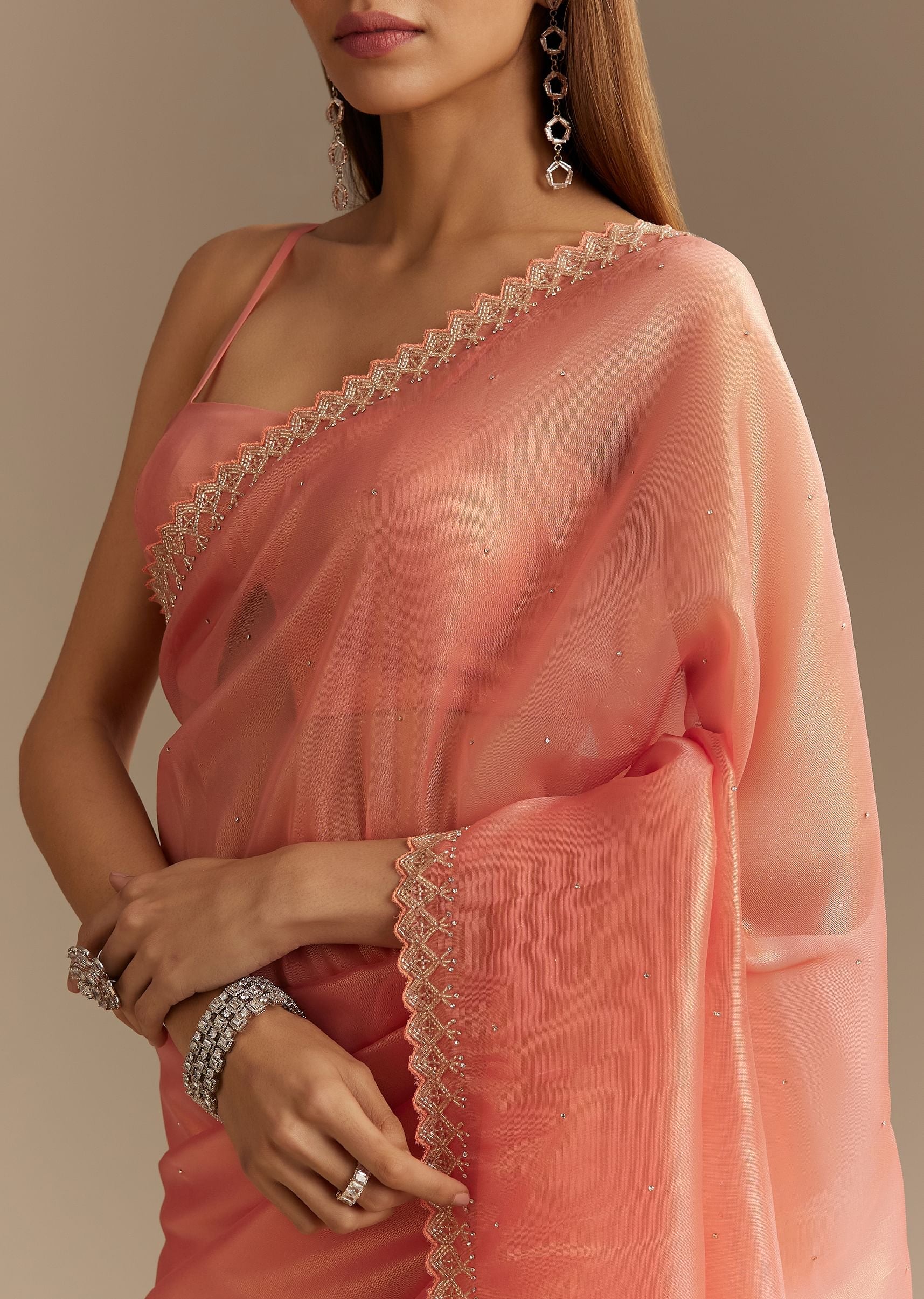 peach-tissue-saree-with-stones-cutdana-embellishments-and-scallop-border-sg294557-1_ef32fe26-29e5-45fa-8b00-aee25694b962.jpg
