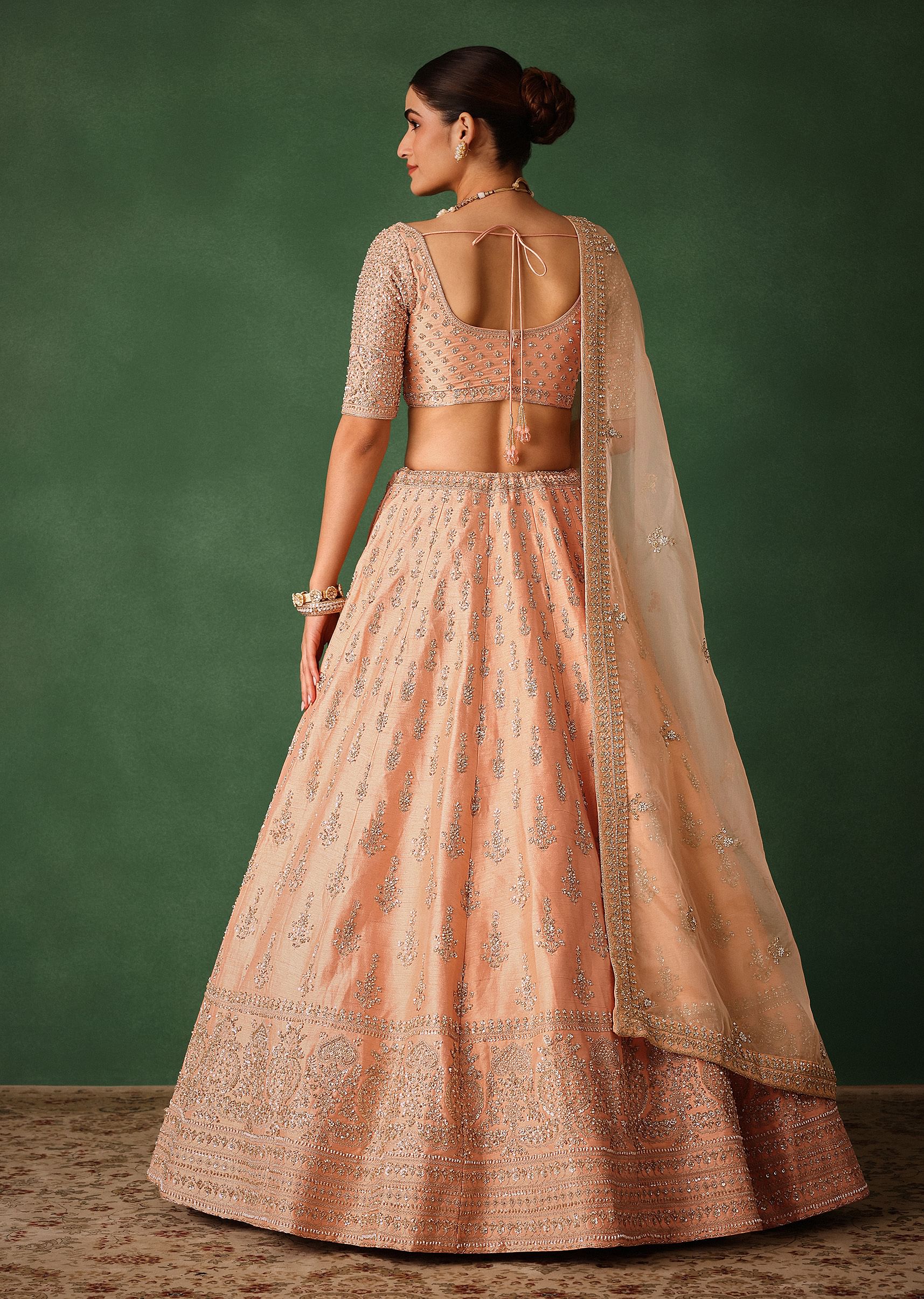 peach_hand_embroidered_raw_silk_lehenga_set_with_butti_work-sg224060_4_2c109765-a1cd-495e-bad5-b7090903d977.jpg