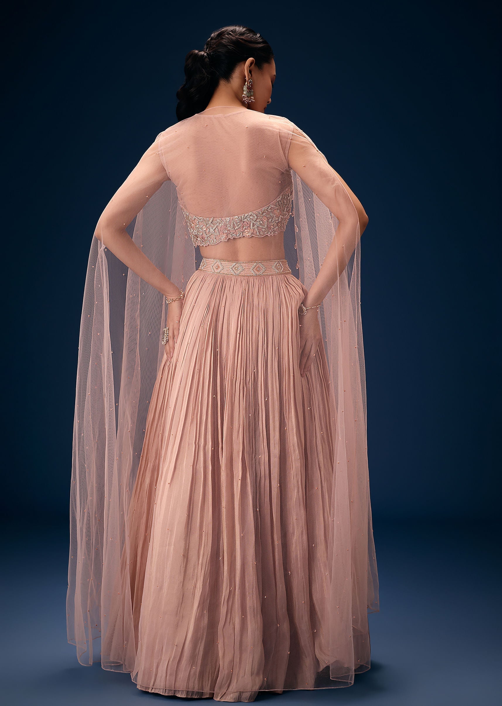 peach_ruched_lehenga_with_embroidered_blouse_and_net_cape-sg251638_3_5171e773-f804-450a-b057-253e3b6597e0.jpg