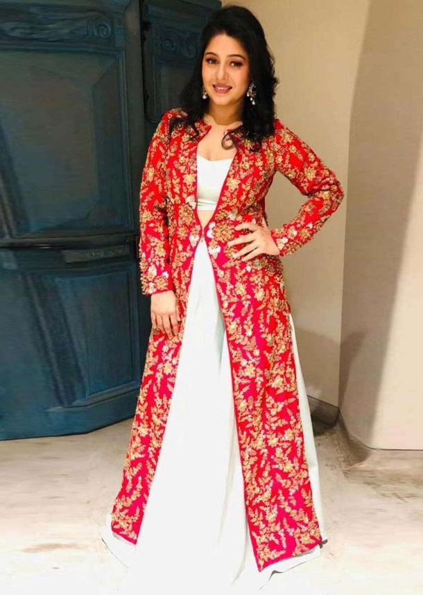 Mint green skirt and strap less corset blouse paired with fuchsia pink jacket with trial