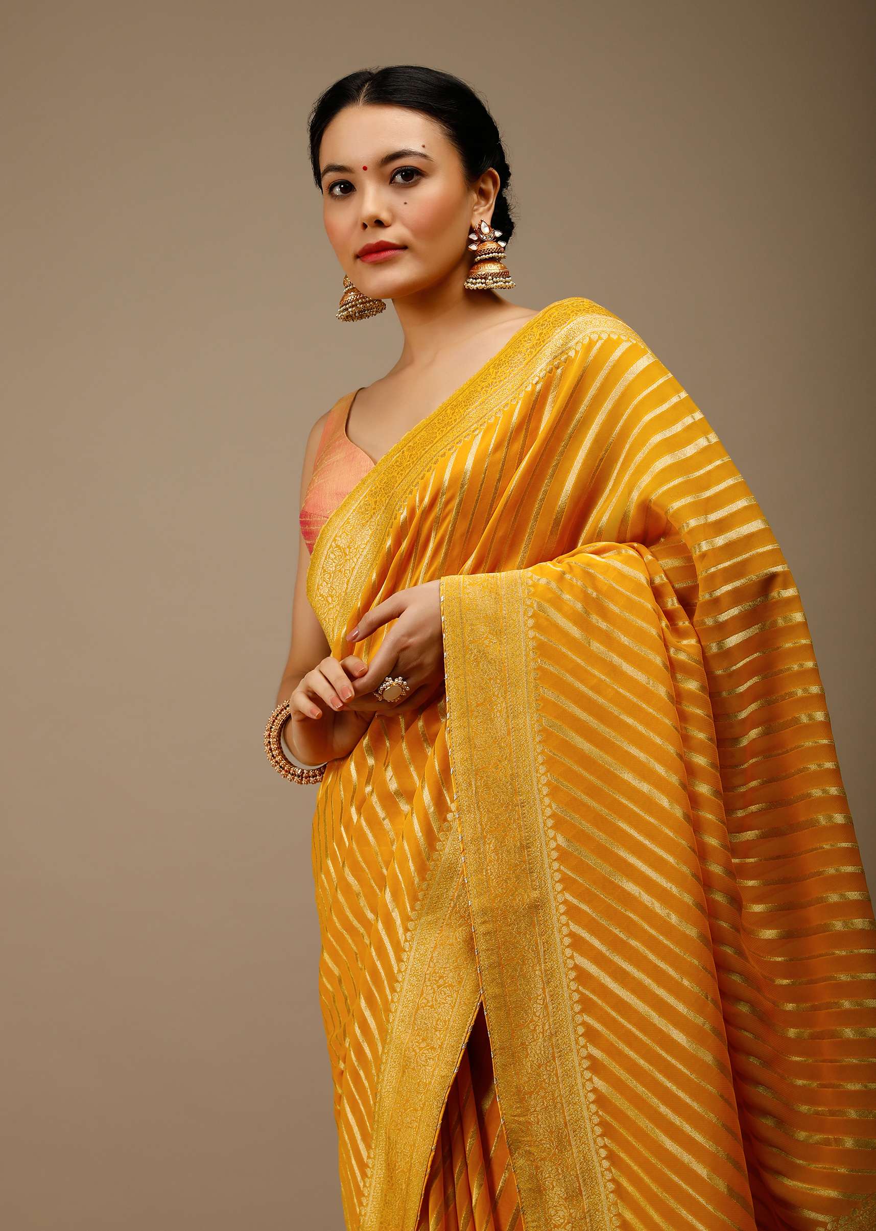 radiant-yellow-saree-in-georgette-with-brocade-woven-diagonal-stripes-and-floral-border-online-kalki-fashion-j004pf1081y-sg70054_4_d960c05a-b598-41dd-a1eb-d22cfd2fde05.jpg