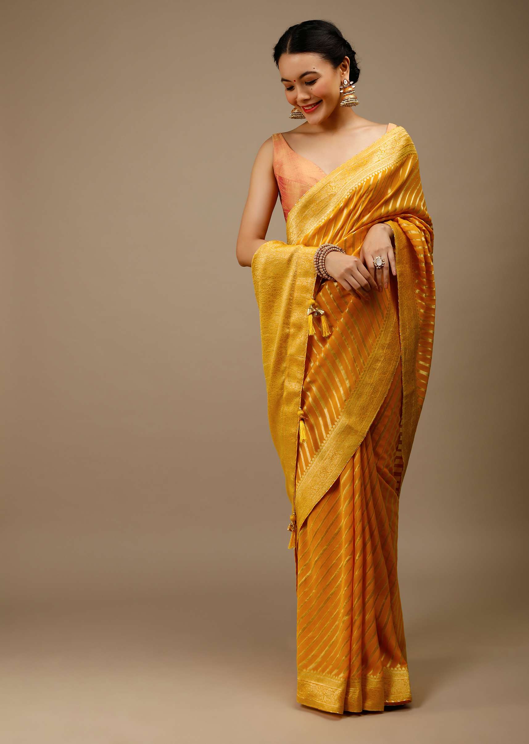 radiant-yellow-saree-in-georgette-with-brocade-woven-diagonal-stripes-and-floral-border-online-kalki-fashion-j004pf1081y-sg70054_8_04ef2d8e-b9cd-4908-81b3-ca7bf64754ed.jpg