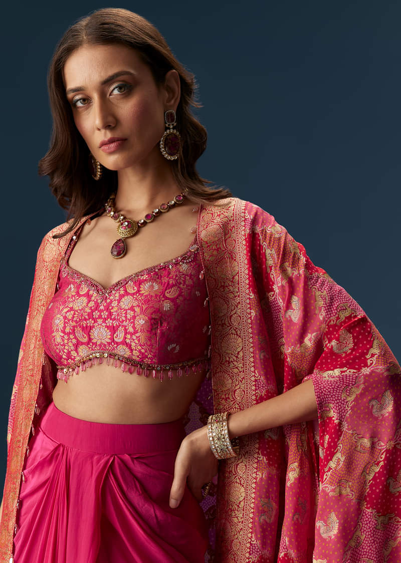 rani-pink-embellished-blouse-and-drape-skirt-set-with-statement-cape-sg306618-2_815271db-e42c-42dc-aeb4-8ecd7ebf2b06.jpg