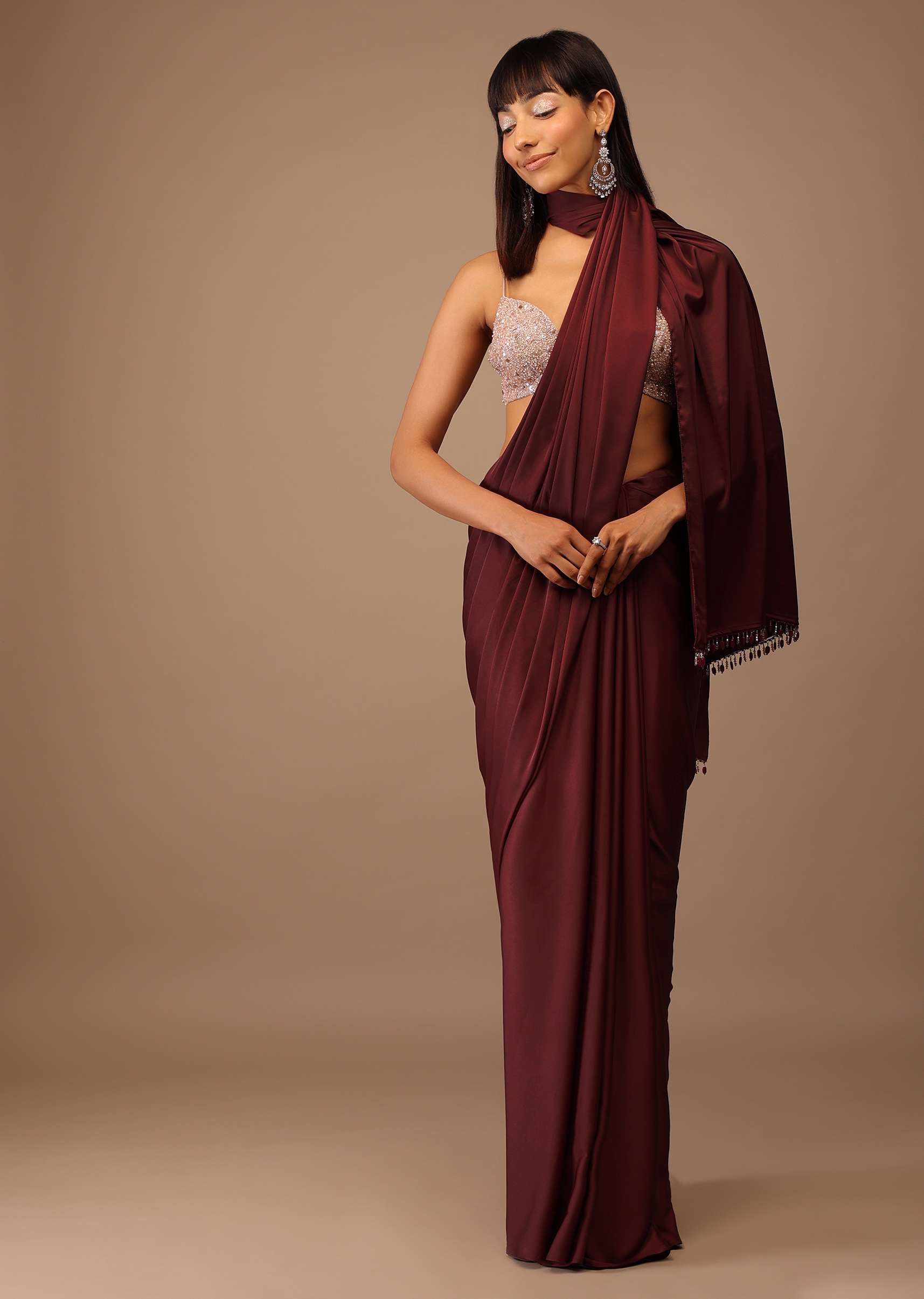 red_satin_saree_with_fringes_on_the_pallu_paired_with_hand_embroidered_5_23af32d3-9015-4b18-bc83-e519e3ffd3d1.jpg